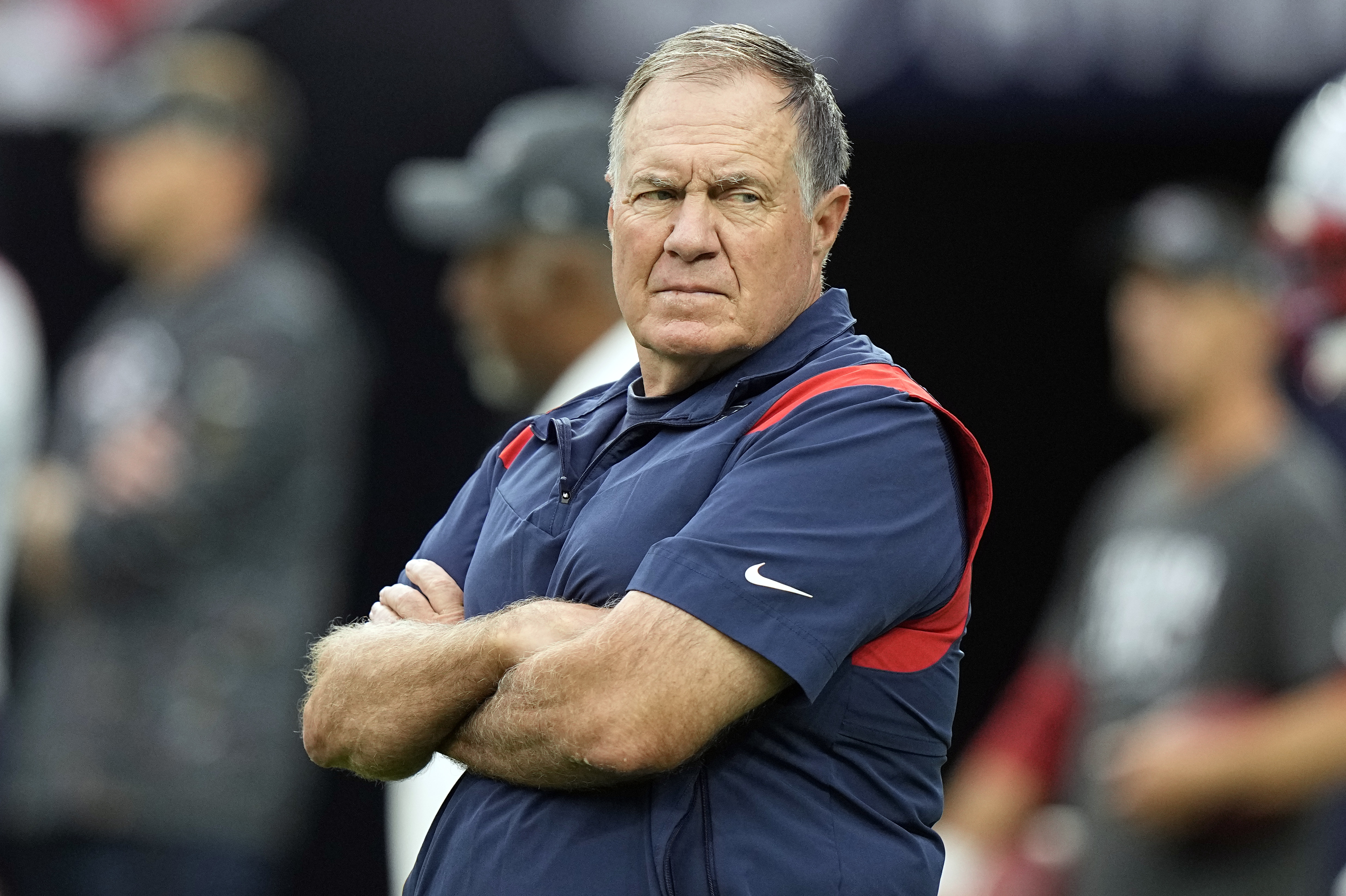New England Patriots head coach Bill Belichick watches his team warm up before an NFL football game against the Houston Texans Sunday, Oct. 10, 2021, in Houston. (AP Photo/Eric Christian Smith)