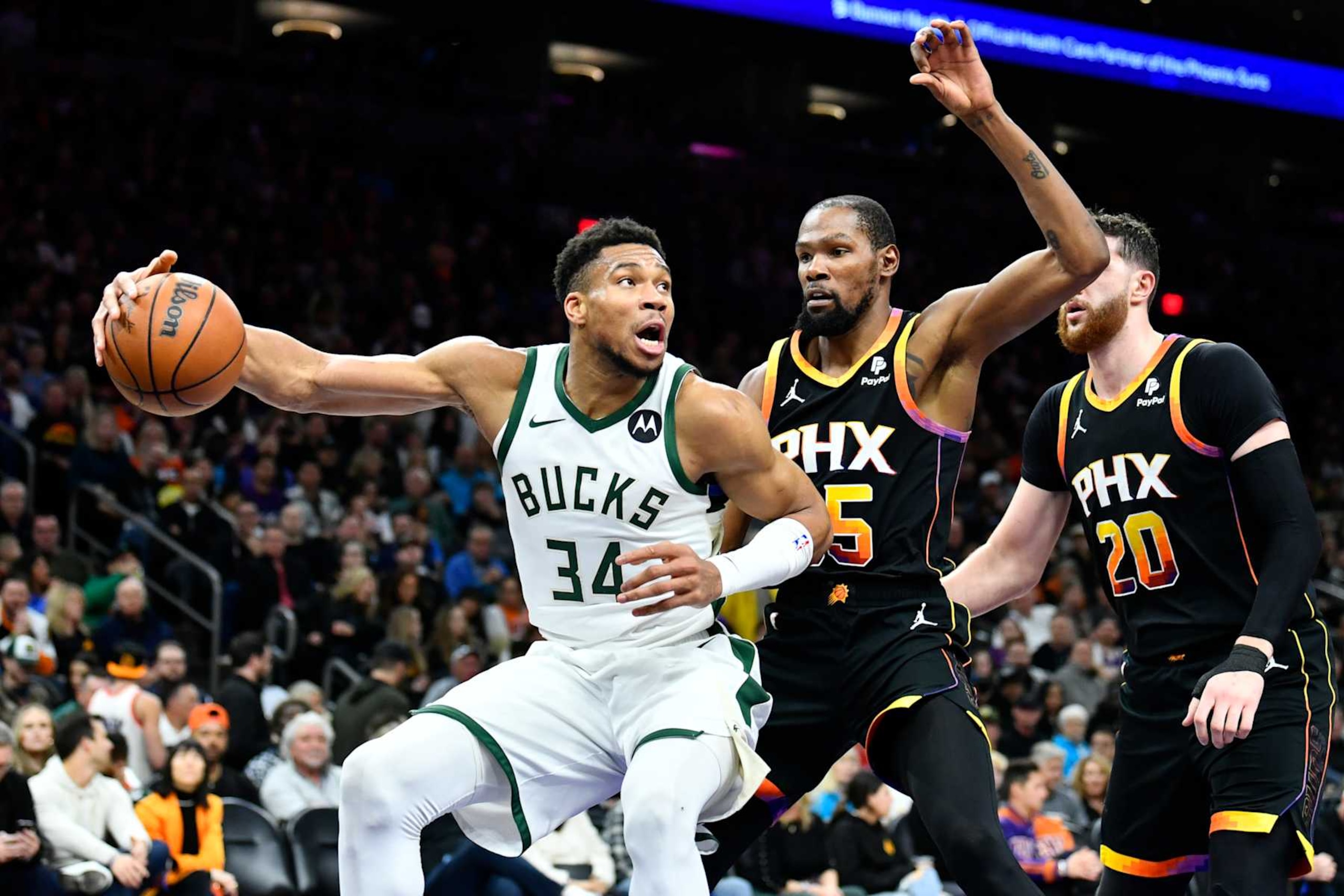 PHOENIX, ARIZONA - FEBRUARY 06: Giannis Antetokounmpo #34 of the Milwaukee Bucks drives to the basket against Kevin Durant #35 of the Phoenix Suns during the second half of the NBA game at Footprint Center on February 06, 2024 in Phoenix, Arizona. NOTE TO USER: User expressly acknowledges and agrees that, by downloading and or using this photograph, User is consenting to the terms and conditions of the Getty Images License Agreement. (Photo by Kelsey Grant/Getty Images) PHOENIX, ARIZONA - FEBRUARY 06: Giannis Antetokounmpo #34 of the Milwaukee Bucks drives to the basket against Kevin Durant #35 of the Phoenix Suns during the second half of the NBA game at Footprint Center on February 06, 2024 in Phoenix, Arizona. NOTE TO USER: User expressly acknowledges and agrees that, by downloading and or using this photograph, User is consenting to the terms and conditions of the Getty Images License Agreement. (Photo by Kelsey Grant/Getty Images)