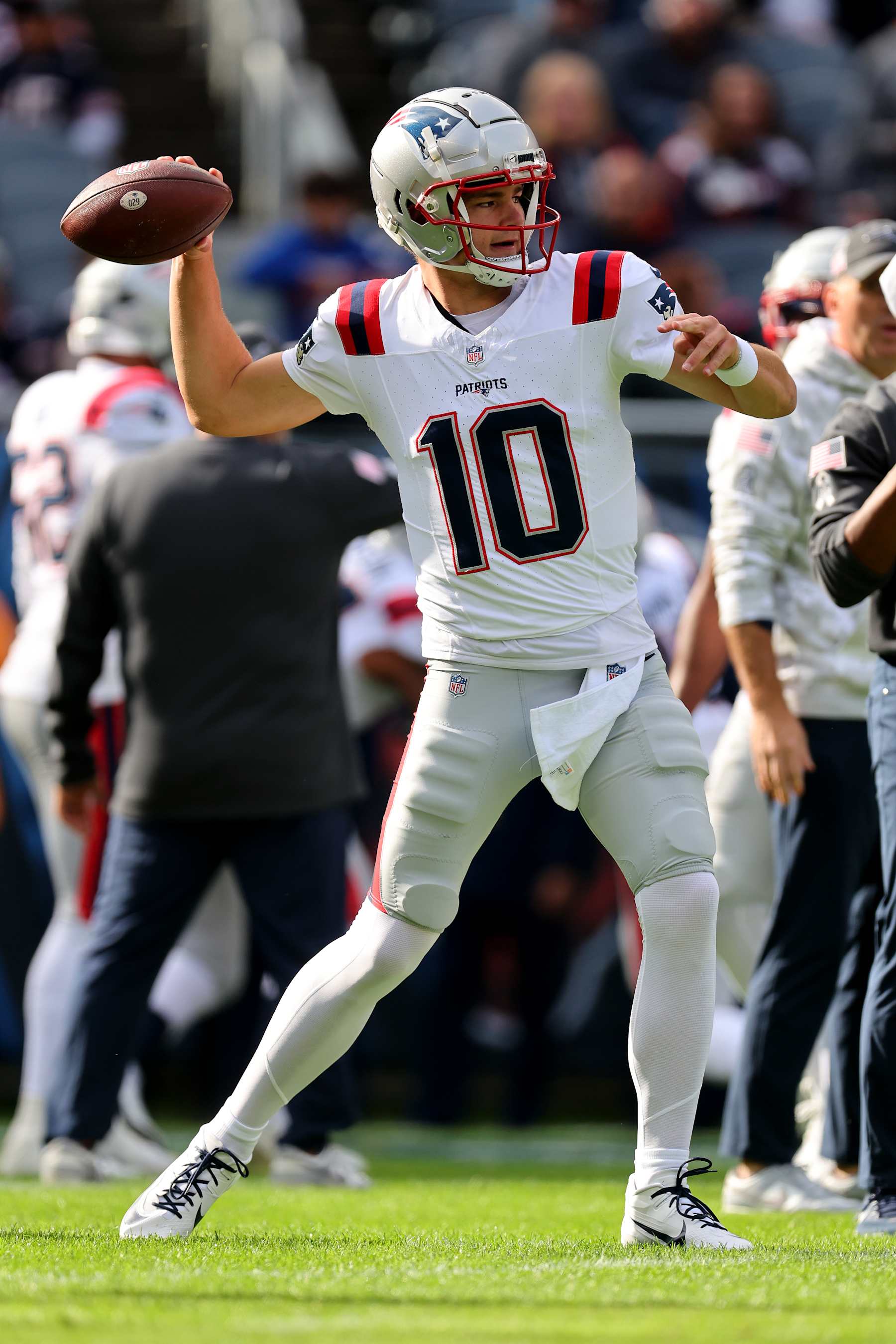 CHICAGO, ILLINOIS - NOVEMBER 10: Drake Maye #10 of the New England Patriots warms up before the game against the Chicago Bears at Soldier Field on November 10, 2024 in Chicago, Illinois. (Photo by Michael Reaves/Getty Images)