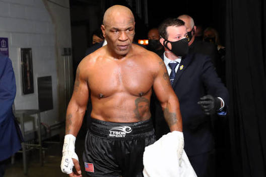 LOS ANGELES, CALIFORNIA - NOVEMBER 28: Mike Tyson exits the ring after receiving a split draw against Roy Jones Jr. during Mike Tyson vs Roy Jones Jr. presented by Triller at Staples Center on November 28, 2020 in Los Angeles, California. (Photo by Joe Scarnici/Getty Images for Triller)