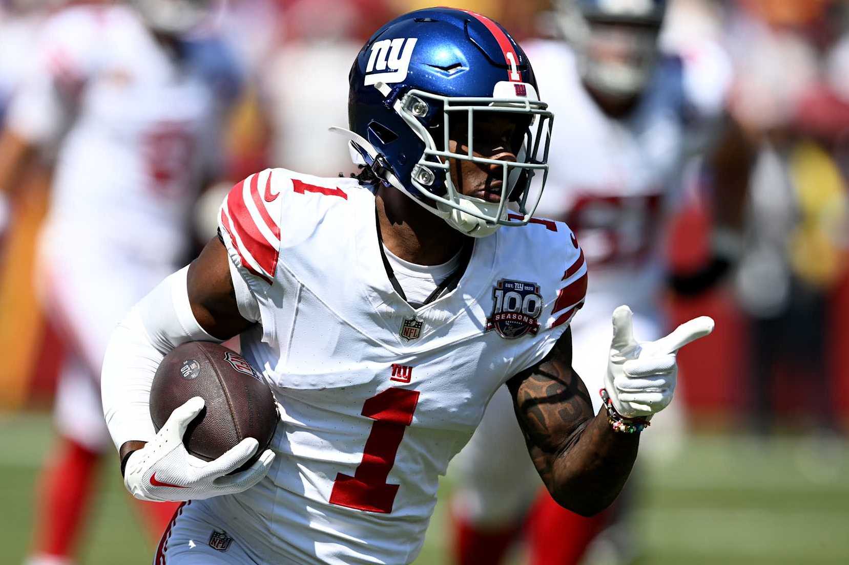 LANDOVER, MARYLAND - SEPTEMBER 15: Malik Nabers #1 of the New York Giants runs with the ball after a catch against the Washington Commanders at Northwest Stadium on September 15, 2024 in Landover, Maryland. (Photo by G Fiume/Getty Images)