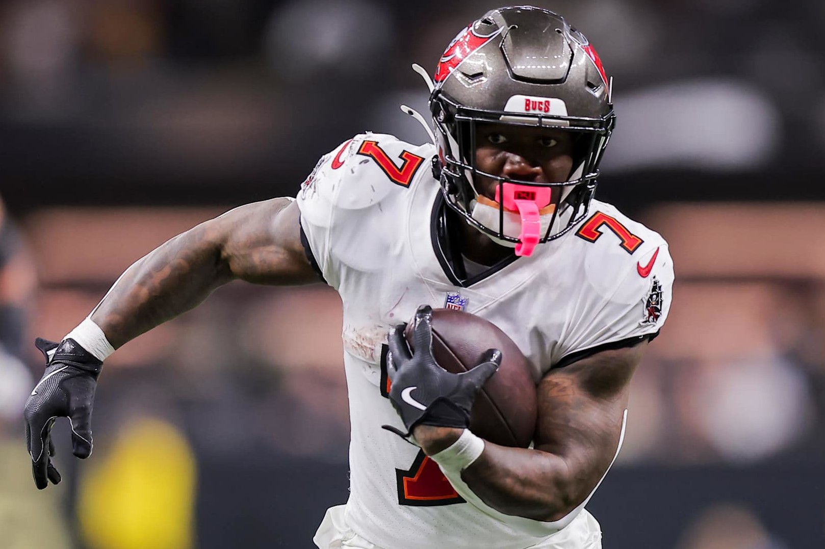 NEW ORLEANS, LOUISIANA - OCTOBER 13: Bucky Irving #7 of the Tampa Bay Buccaneers carries the ball against the New Orleans Saints during the fourth quarter at Caesars Superdome on October 13, 2024 in New Orleans, Louisiana. (Photo by Jonathan Bachman/Getty Images)
