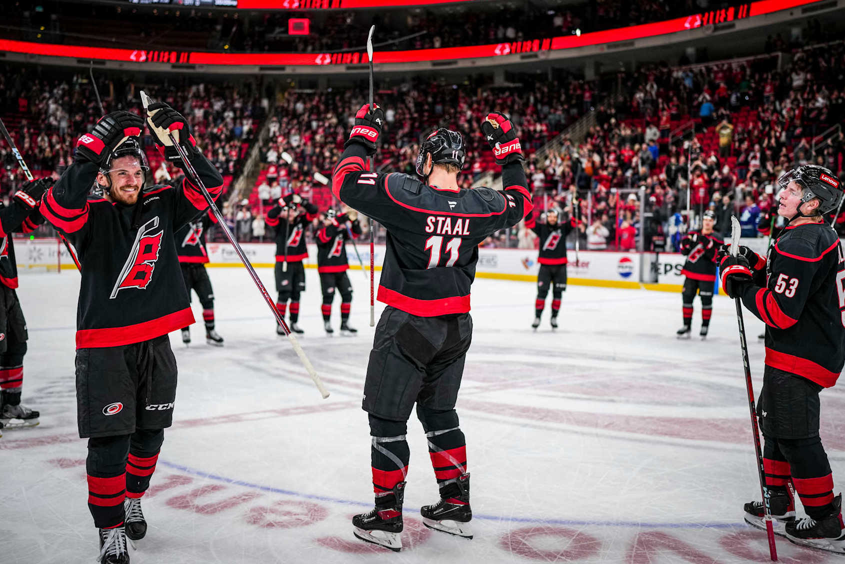 RALEIGH, NORTH CAROLINA - JANUARY 09: Jordan Staal #11 of the Carolina Hurricanes salutes the crowd after defeating the Toronto Maple Leafs at Lenovo Center on January 09, 2025 in Raleigh, North Carolina. (Photo by Josh Lavallee/NHLI via Getty Images)