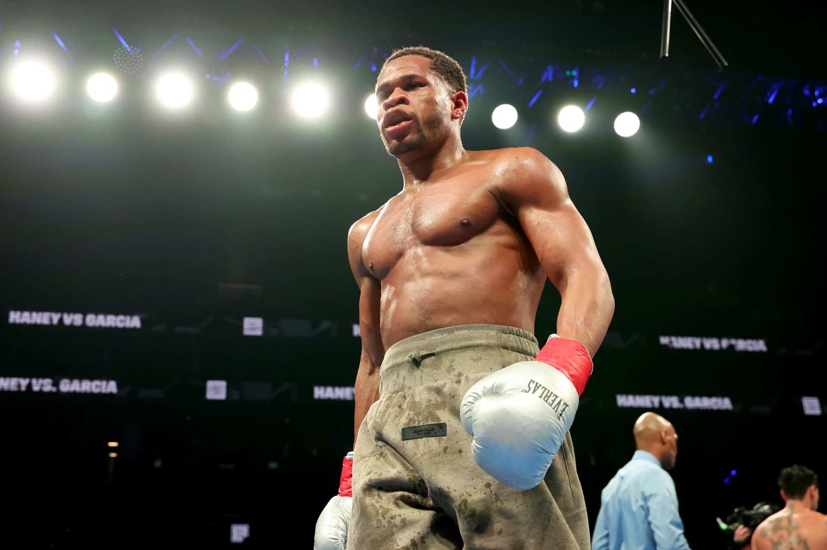 NEW YORK, NEW YORK - APRIL 20: Devin Haney (gray trunks) walks back to his corner during their WBC Super Lightweight title bout against Ryan Garcia at Barclays Center on April 20, 2024 in New York City.  (Photo by Al Bello/Getty Images)