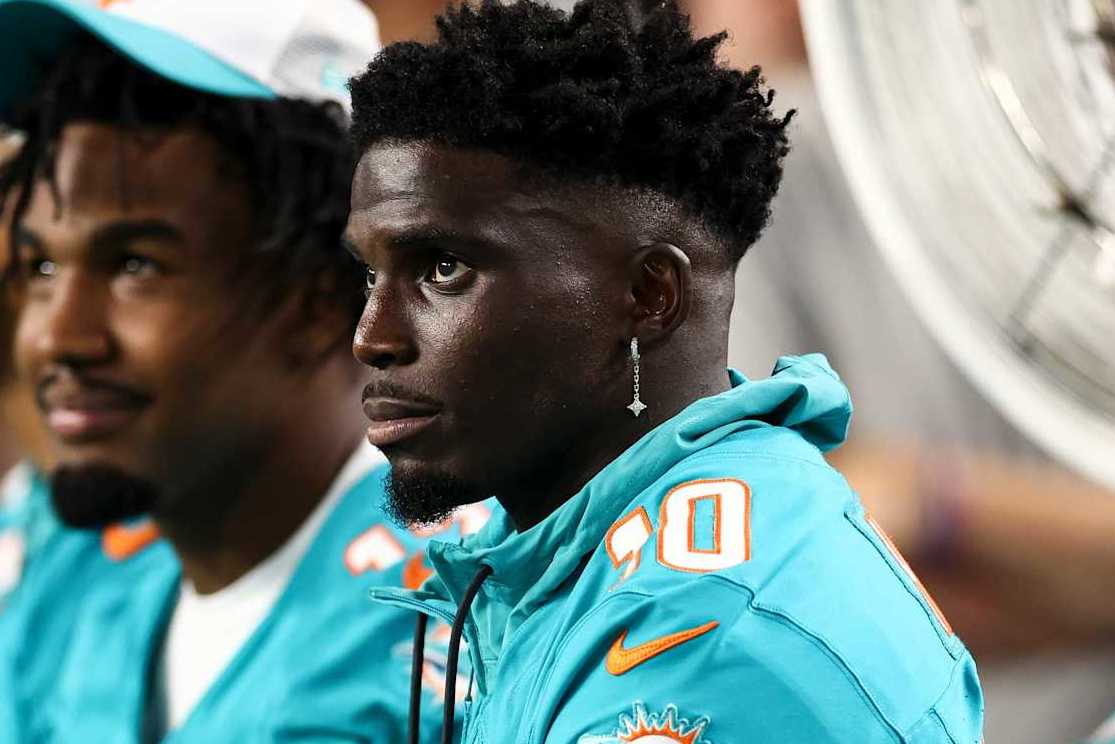 MIAMI GARDENS, FL - AUGUST 17: Tyreek Hill #10 of the Miami Dolphins sits on the bench during the third quarter of an NFL preseason football game against the Washington Commanders at Hard Rock Stadium on August 17, 2024 in Miami Gardens, FL. (Photo by Kevin Sabitus/Getty Images)