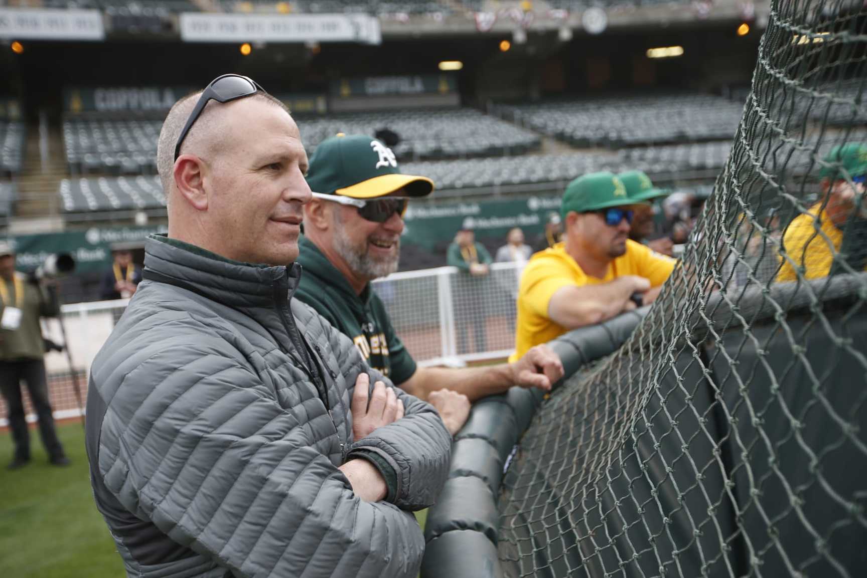 OAKLAND, CA - APRIL 18: General Manager David Forst and Manager Mark Kotsay #7 of the Oakland Athletics on the field before the game against the Baltimore Orioles at RingCentral Coliseum on April 18, 2022 in Oakland, California. The Athletics defeated the Orioles 5-1. (Photo by Michael Zagaris/Oakland Athletics/Getty Images)