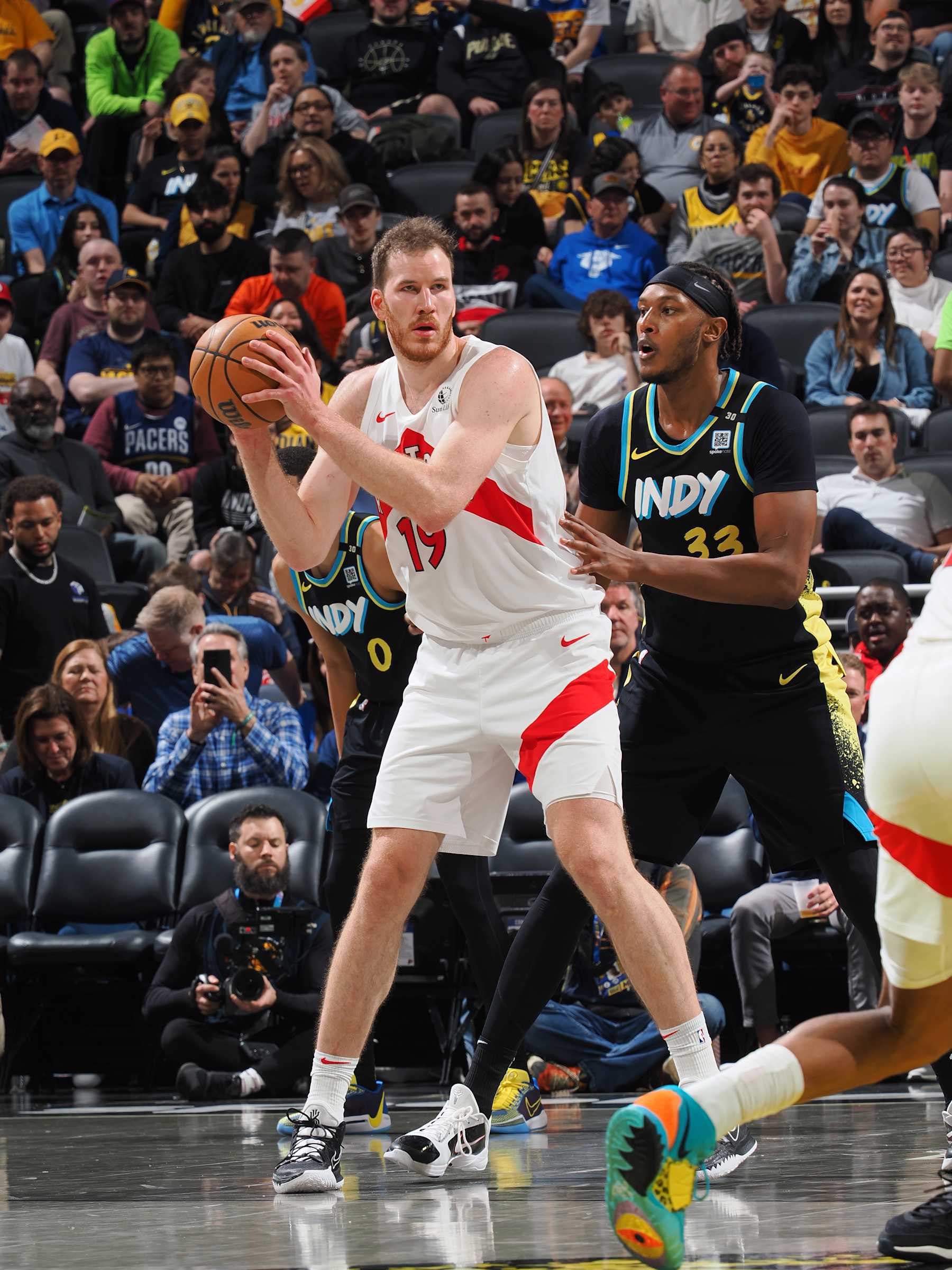 INDIANAPOLIS, IN - FEBRUARY 26: Jakob Poeltl #19 of the Toronto Raptors handles the ball during the game against the Indiana Pacers on February 26, 2024 at Gainbridge Fieldhouse in Indianapolis, Indiana. NOTE TO USER: User expressly acknowledges and agrees that, by downloading and or using this Photograph, user is consenting to the terms and conditions of the Getty Images License Agreement. Mandatory Copyright Notice: Copyright 2024 NBAE (Photo by Ron Hoskins/NBAE via Getty Images)