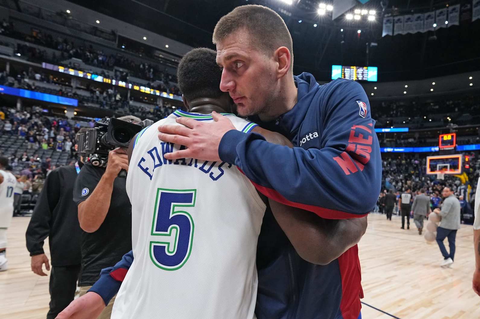 DENVER, CO - MARCH 29: Anthony Edwards #5 of the Minnesota Timberwolves greets Nikola Jokic #15 of the Denver Nuggets after the game on March 29, 2024 at the Ball Arena in Denver, Colorado. NOTE TO USER: User expressly acknowledges and agrees that, by downloading and/or using this Photograph, user is consenting to the terms and conditions of the Getty Images License Agreement. Mandatory Copyright Notice: Copyright 2024 NBAE (Photo by Bart Young/NBAE via Getty Images)
