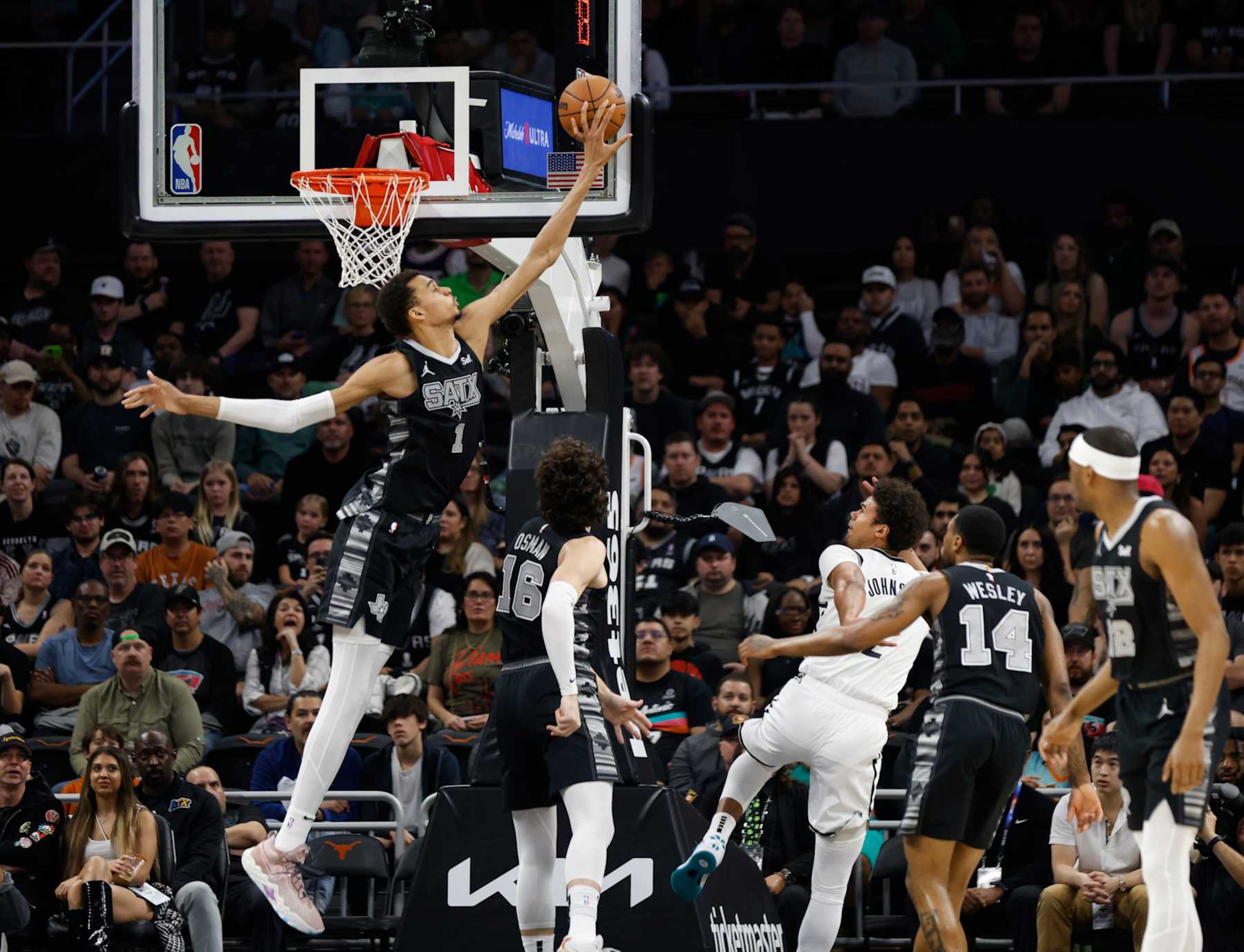 SAN ANTONIO, TX - MARCH 17  Victor Wembanyama #1 of the San Antonio Spurs blocks the shot of Cameron Johnson #2 of the Brooklyn Nets but Johnson was fouled before the shot in the first half at Moody Center on March 17, 2024 in San Antonio, Texas. NOTE TO USER: User expressly acknowledges and agrees that, by downloading and or using this photograph, User is consenting to terms and conditions of the Getty Images License Agreement. (Photo by Ronald Cortes/Getty Images)