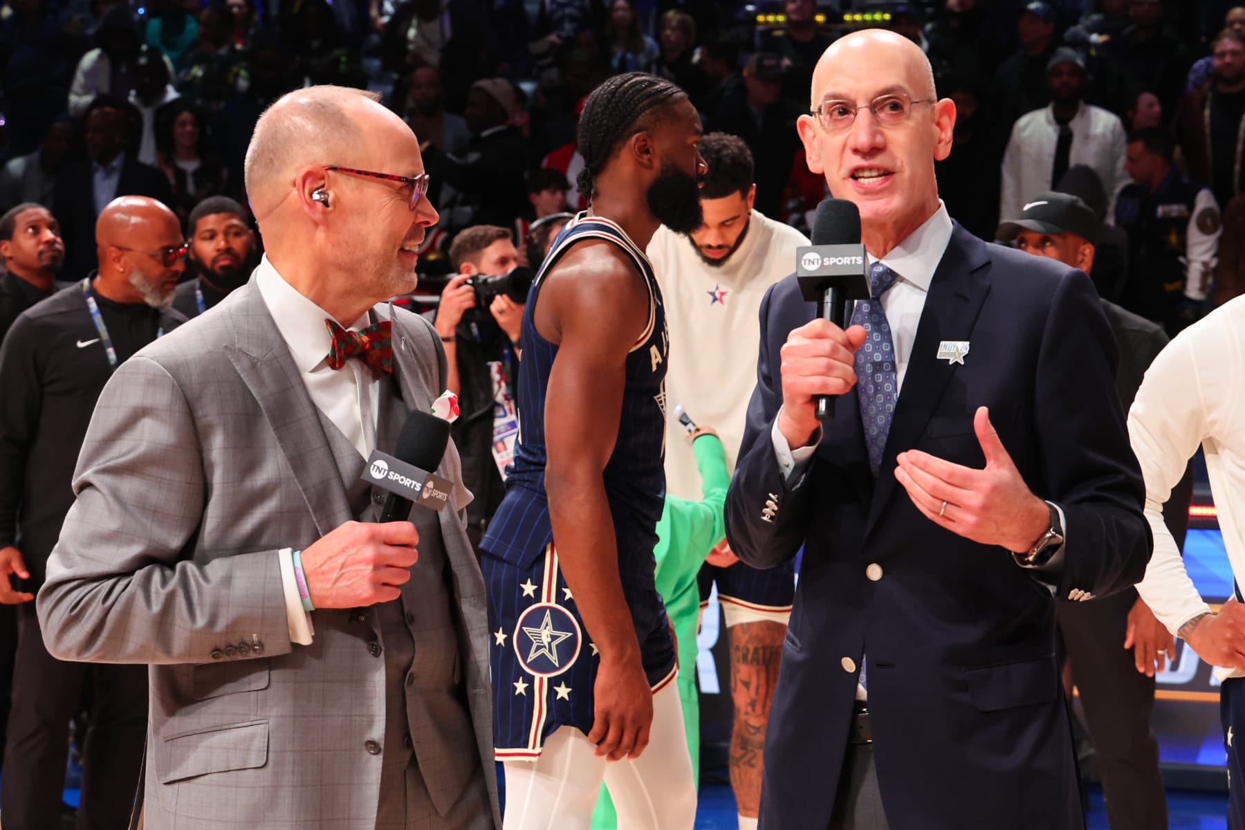 INDIANAPOLIS, INDIANA - FEBRUARY 18: Ernie Johnson Jr. and  NBA Commissioner Adam Silver speak on the court during the 2024 NBA All-Star Game at Gainbridge Fieldhouse on February 18, 2024 in Indianapolis, Indiana. NOTE TO USER: User expressly acknowledges and agrees that, by downloading and or using this photograph, User is consenting to the terms and conditions of the Getty Images License Agreement. (Photo by Stacy Revere/Getty Images)