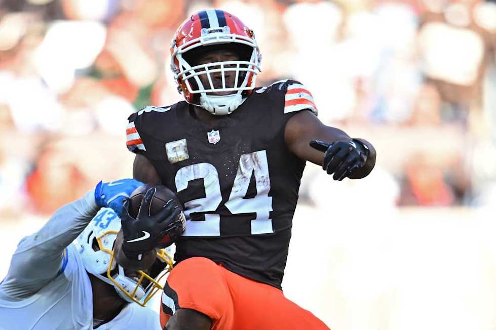 CLEVELAND, OHIO - NOVEMBER 03: Troy Dye #43 of the Los Angeles Chargers tackles Nick Chubb #24 of the Cleveland Browns in the fourth quarter of a game at Huntington Bank Field on November 03, 2024 in Cleveland, Ohio. (Photo by Jason Miller/Getty Images)