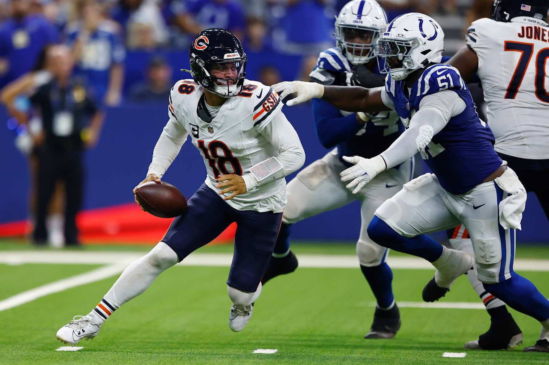 INDIANAPOLIS, IN - SEPTEMBER 22: Indianapolis Colts defensive end Kwity Paye (51) puts pressure on Chicago Bears quarterback Caleb Williams (18) during and NFL game between the Chicago Bears and the Indianapolis Colts on September 22, 2024 at Lucas Oil Stadium in Indianapolis, IN.(Photo by Jeffrey Brown/Icon Sportswire via Getty Images)