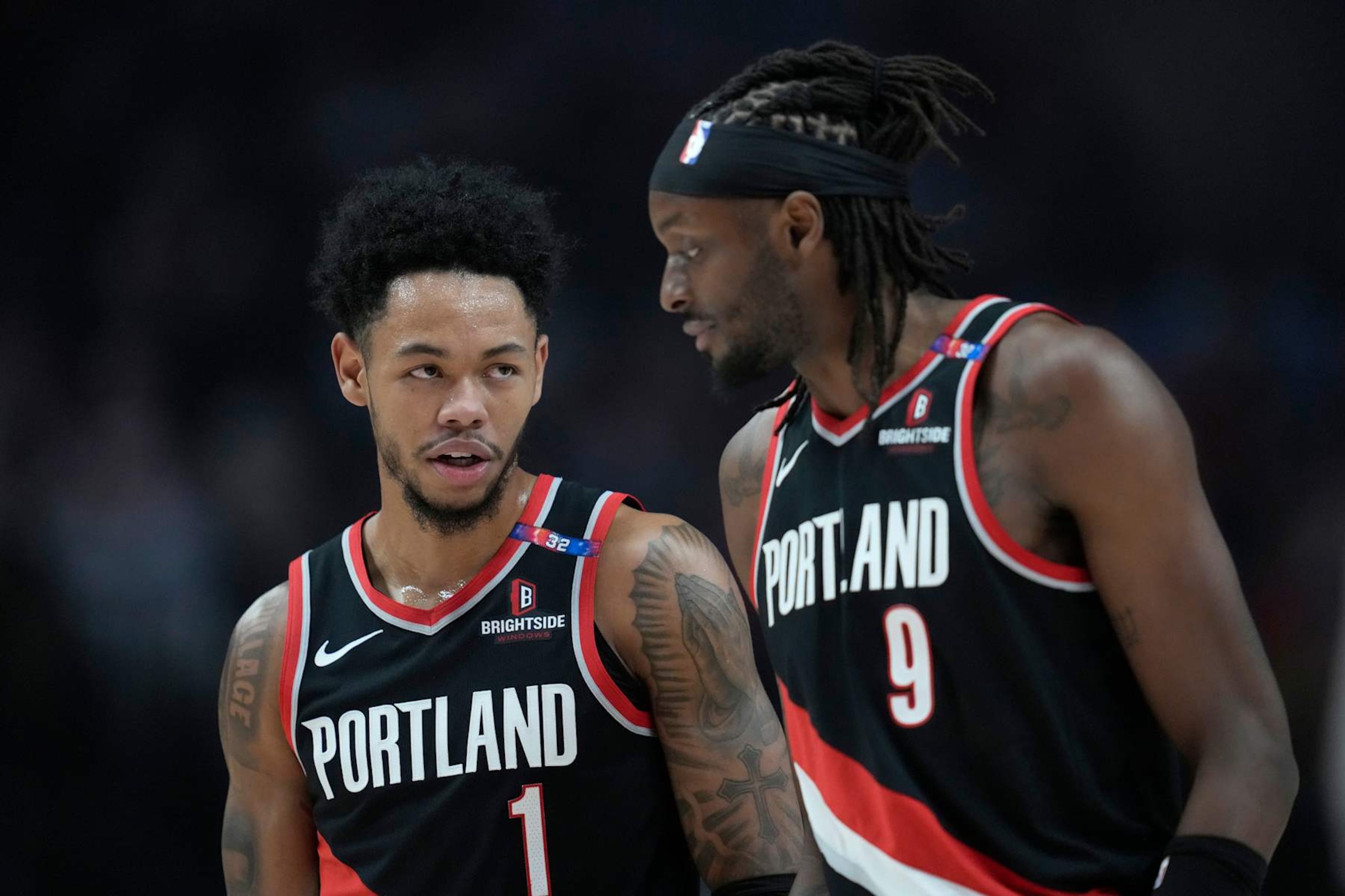 PORTLAND, OREGON - DECEMBER 01: Anfernee Simons #1 talks with Jerami Grant #9 of the Portland Trail Blazers during the first half against the Dallas Mavericks at Moda Center on December 01, 2024 in Portland, Oregon. NOTE TO USER: User expressly acknowledges and agrees that, by downloading and or using this photograph, User is consenting to the terms and conditions of the Getty Images License Agreement. (Photo by Soobum Im/Getty Images) PORTLAND, OREGON - DECEMBER 01: Anfernee Simons #1 talks with Jerami Grant #9 of the Portland Trail Blazers during the first half against the Dallas Mavericks at Moda Center on December 01, 2024 in Portland, Oregon. NOTE TO USER: User expressly acknowledges and agrees that, by downloading and or using this photograph, User is consenting to the terms and conditions of the Getty Images License Agreement. (Photo by Soobum Im/Getty Images)