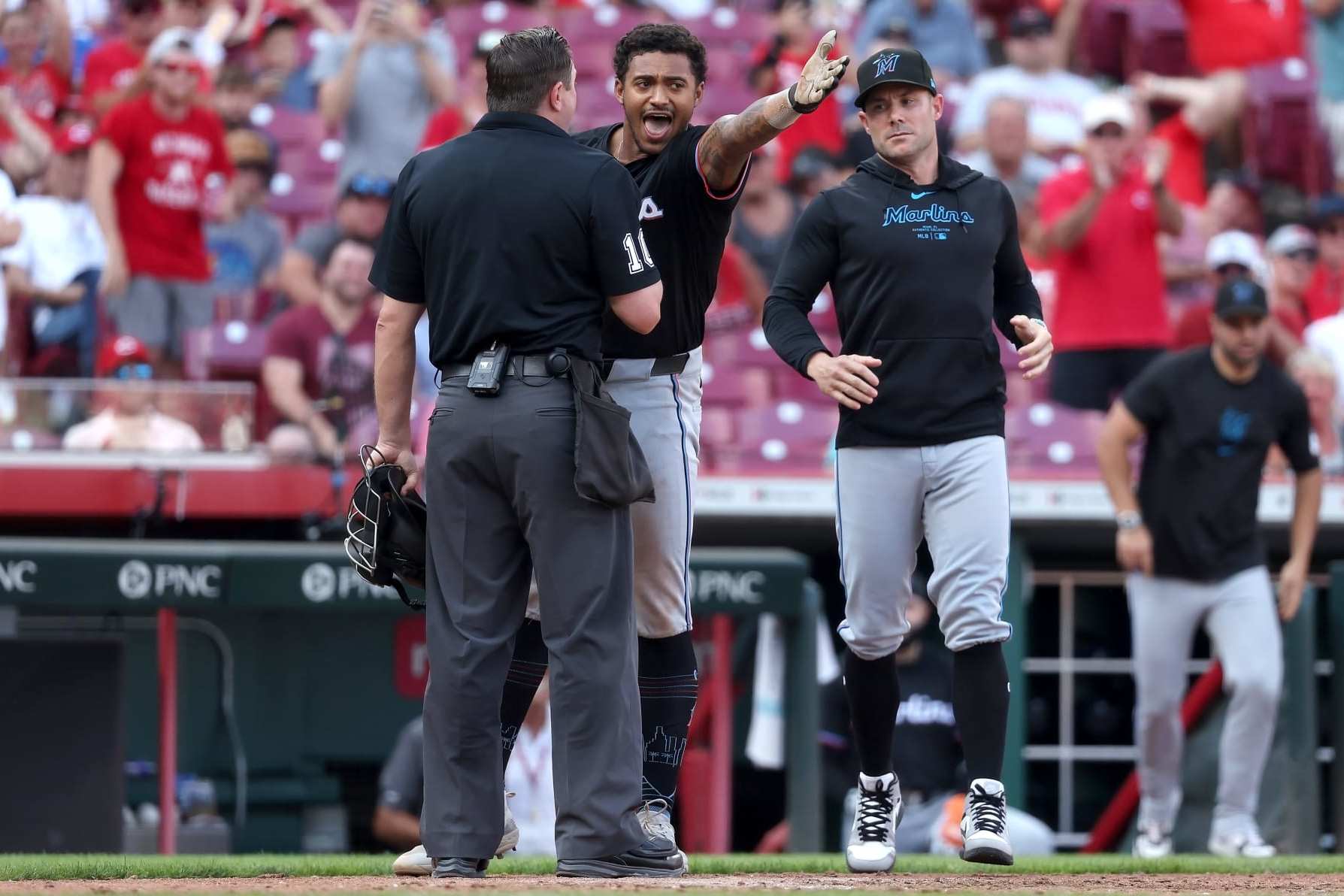 CINCINNATI, OHIO - JULY 13:  Dane Myers #54 of the Miami Marlins argues with home plate umpire Derek Thomas #106 after being thrown out of the game during the eighth inning of the game against the Cincinnati Reds at Great American Ball Park on July 13, 2024 in Cincinnati, Ohio. Cincinnati defeated Miami 10-6. (Photo by Kirk Irwin/Getty Images)