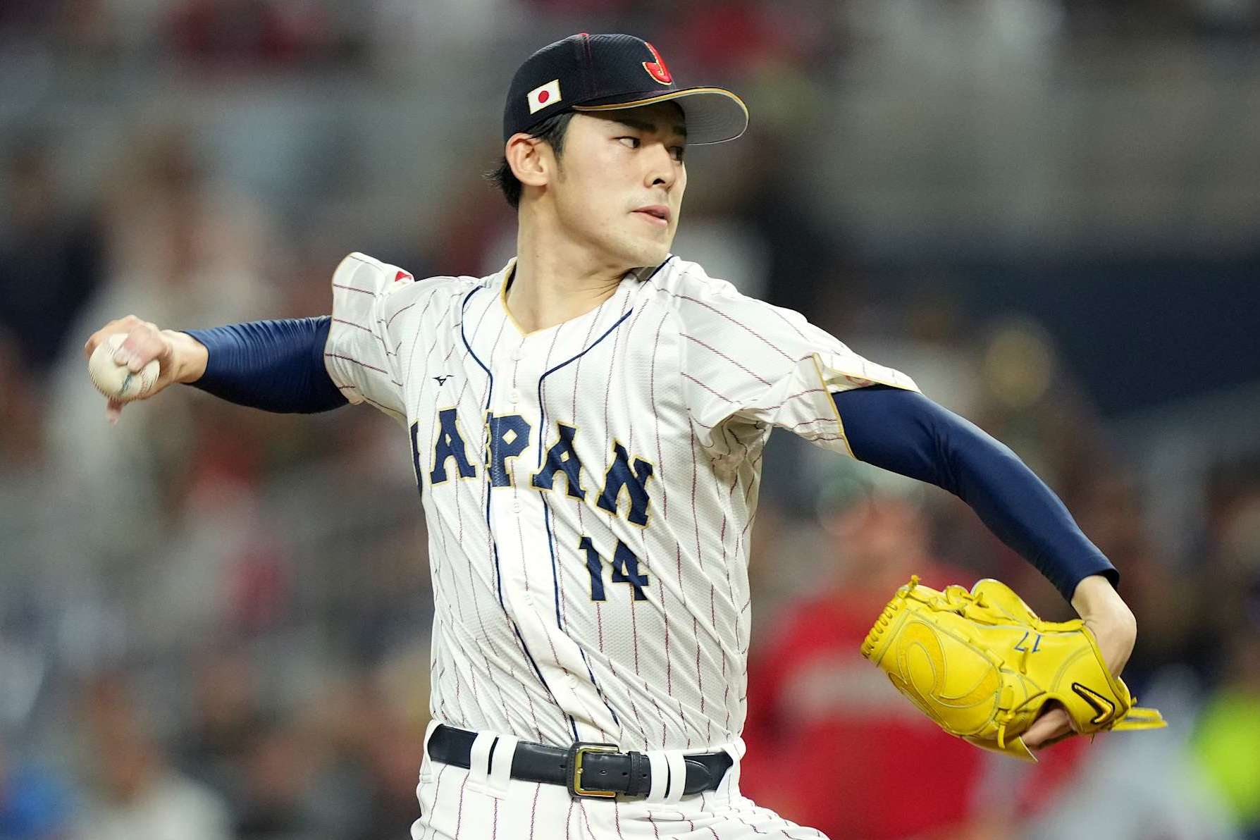 MIAMI, FLORIDA - MARCH 20: Roki Sasaki #14 of Team Japan pitches in the first inning against Team Mexico during the World Baseball Classic Semifinals at loanDepot park on March 20, 2023 in Miami, Florida. (Photo by Eric Espada/Getty Images)