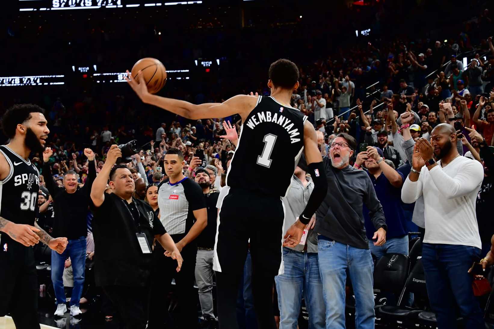 SAN ANTONIO, TX - MARCH 29: Victor Wembanyama #1 of the San Antonio Spurs throws the ball to fans after the game against the New York Knicks on March 29, 2024 at the Frost Bank Center in San Antonio, Texas. NOTE TO USER: User expressly acknowledges and agrees that, by downloading and or using this photograph, user is consenting to the terms and conditions of the Getty Images License Agreement. Mandatory Copyright Notice: Copyright 2024 NBAE (Photos by Michael Gonzales/NBAE via Getty Images)