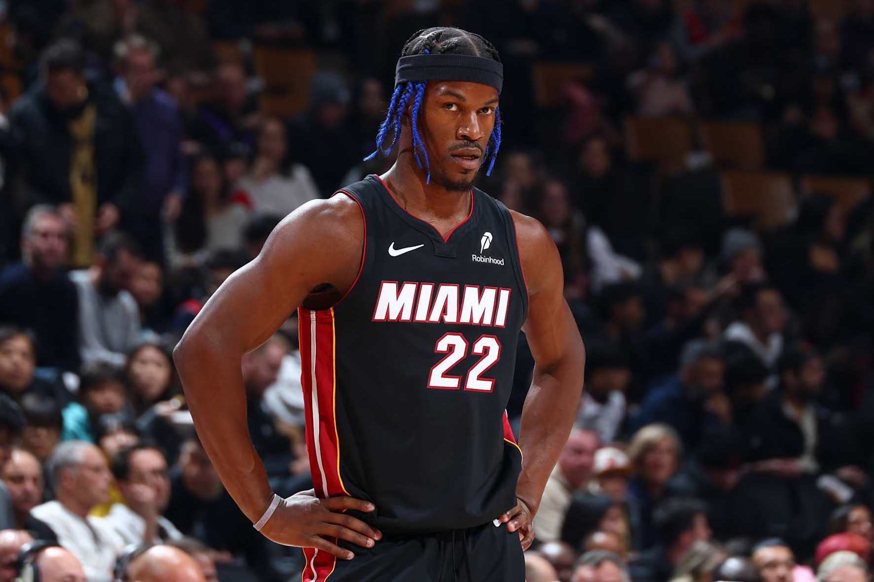 TORONTO, CANADA - DECEMBER 01:  Jimmy Butler #22 of the Miami Heat looks on during the game against the Toronto Raptors on December 1, 2024 at the Scotiabank Arena in Toronto, Ontario, Canada.  NOTE TO USER: User expressly acknowledges and agrees that, by downloading and or using this Photograph, user is consenting to the terms and conditions of the Getty Images License Agreement.  Mandatory Copyright Notice: Copyright 2024 NBAE (Photo by Vaughn Ridley/NBAE via Getty Images)