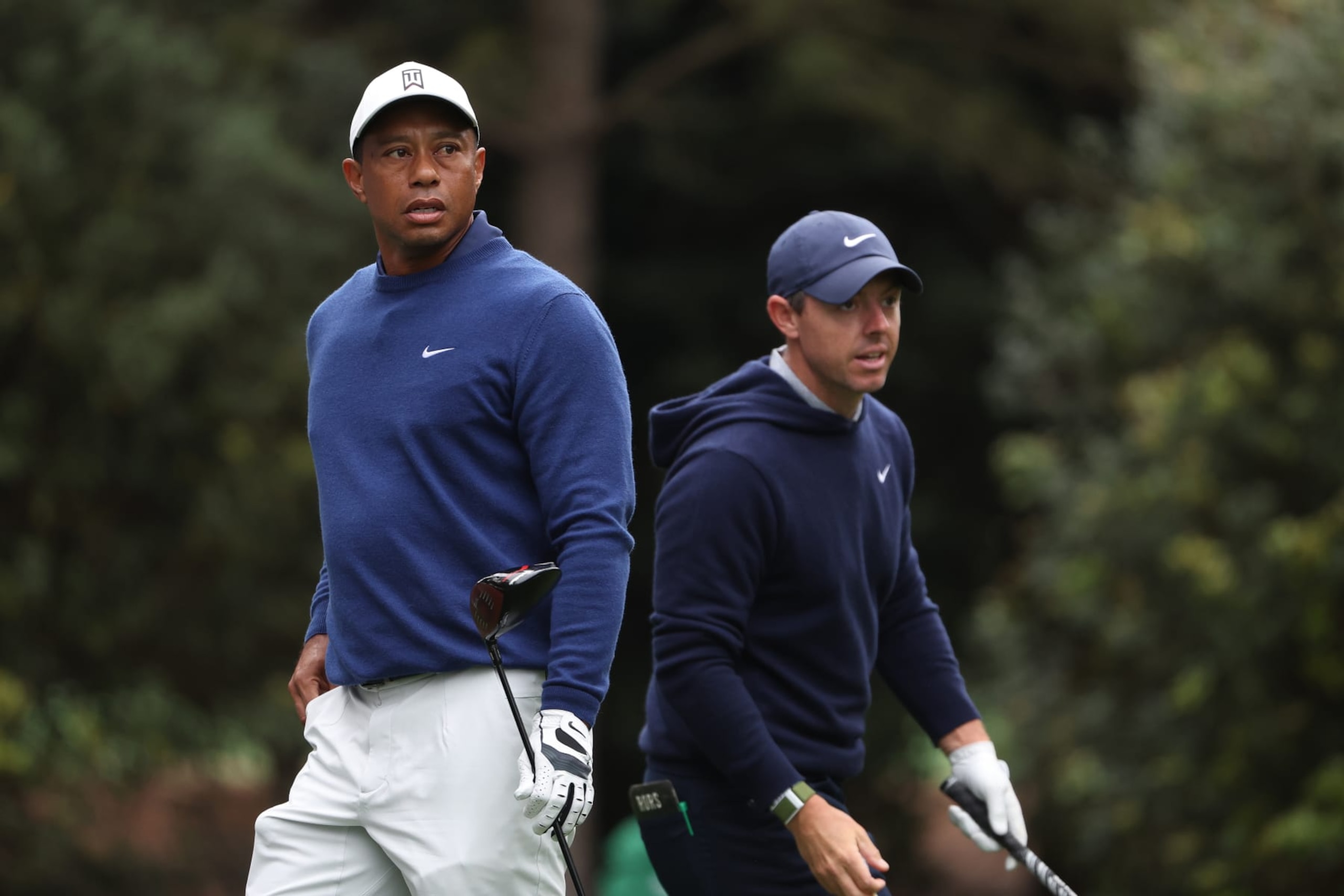 AUGUSTA, GEORGIA - APRIL 03: Tiger Woods of the United States and Rory McIlroy of Northern Ireland look on from the 11th tee during a practice round prior to the 2023 Masters Tournament at Augusta National Golf Club on April 03, 2023 in Augusta, Georgia. (Photo by Christian Petersen/Getty Images)