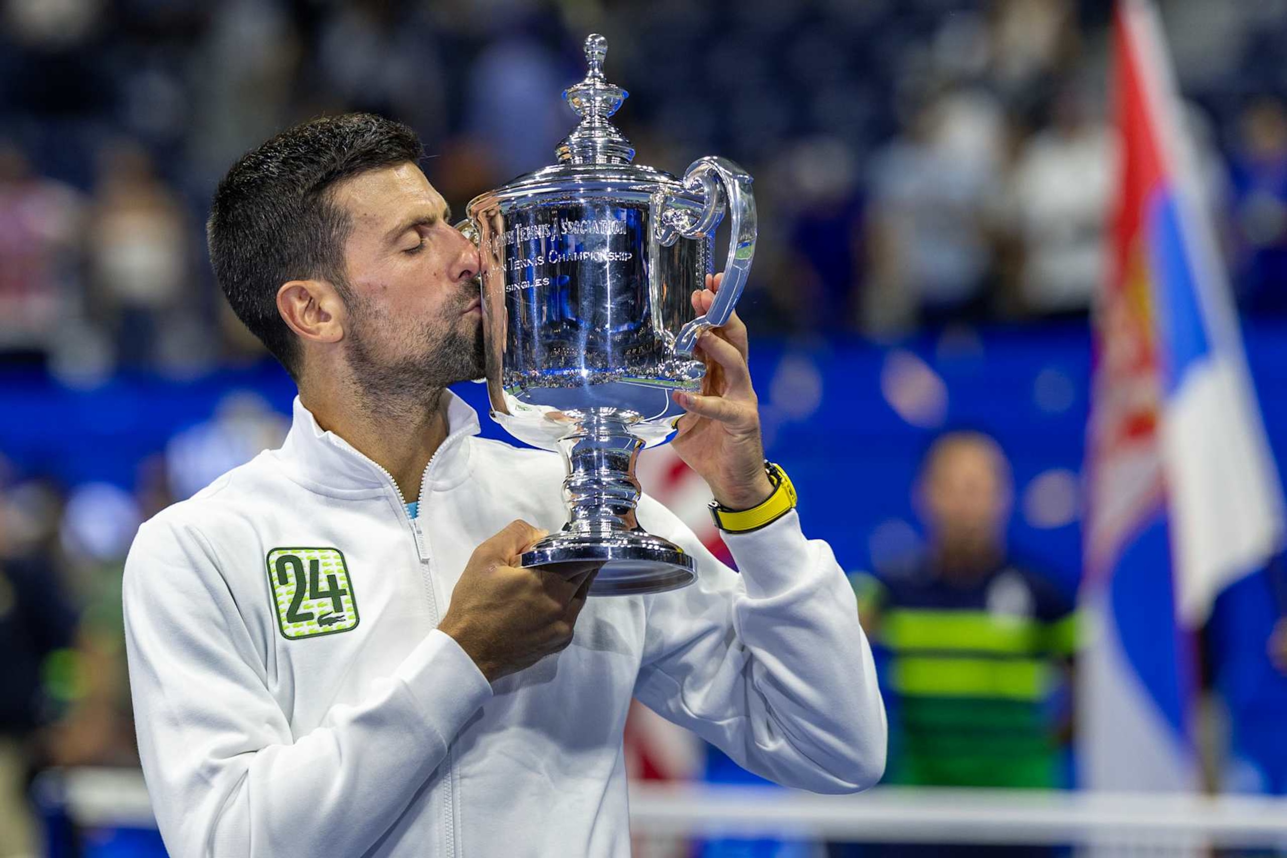 NEW YORK, USA:  September 10:  Novak Djokovic of Serbia with the winners' trophy and wearing a tracksuit representing his 24th grand slam win after his victory against Daniil Medvedev of Russia in the Men's Singles Final on Arthur Ashe Stadium during the US Open Tennis Championship 2023 at the USTA National Tennis Centre on September 10th, 2023 in Flushing, Queens, New York City.  (Photo by Tim Clayton/Corbis via Getty Images)