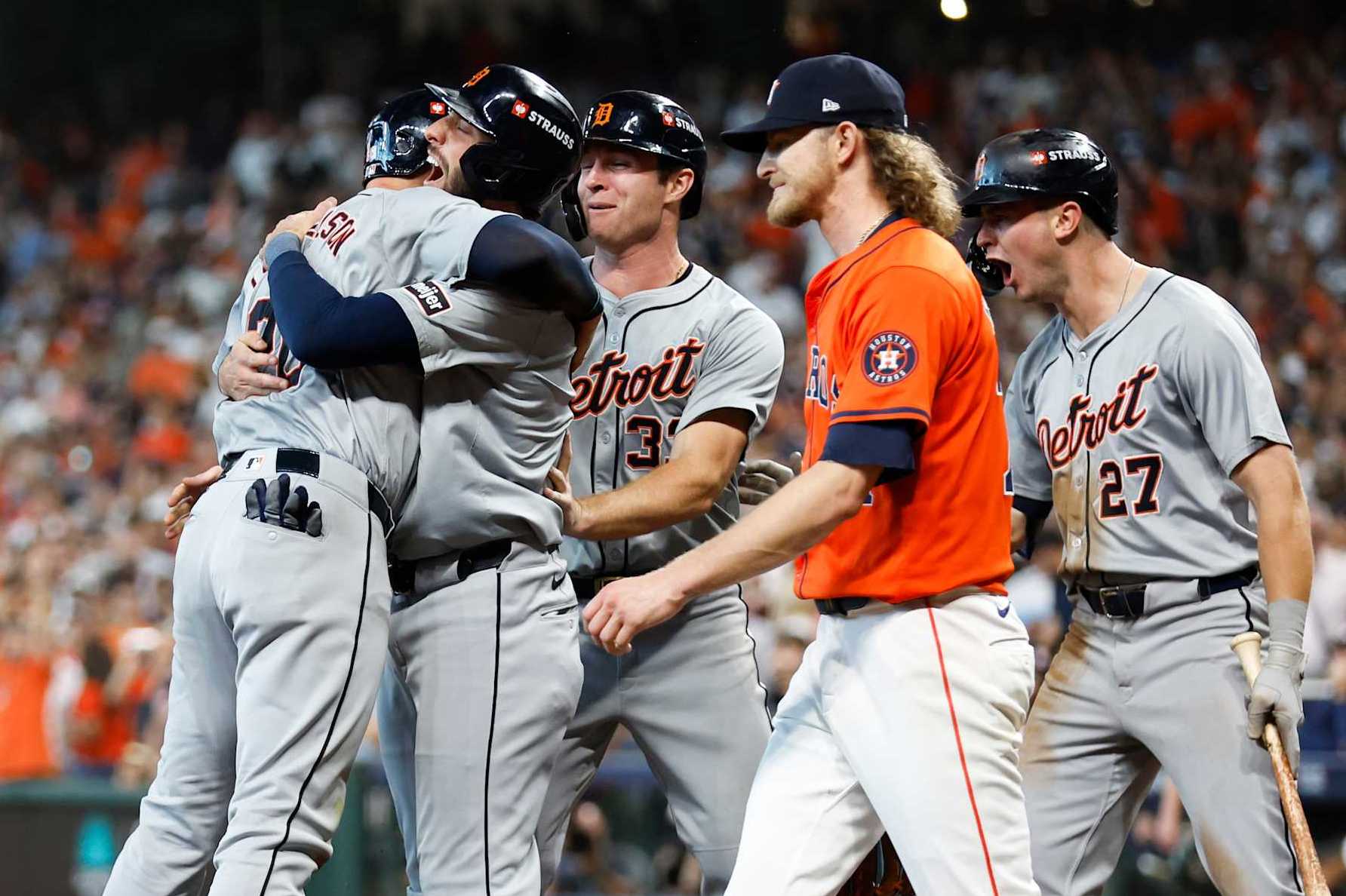 HOUSTON, TEXAS - OCTOBER 02: Spencer Torkelson #20 of the Detroit Tigers celebrates with teammate Matt Vierling #8 after scoring in the eighth inning against the Houston Astros during Game Two of the Wild Card Series at Minute Maid Park on October 02, 2024 in Houston, Texas.  (Photo by Tim Warner/Getty Images)