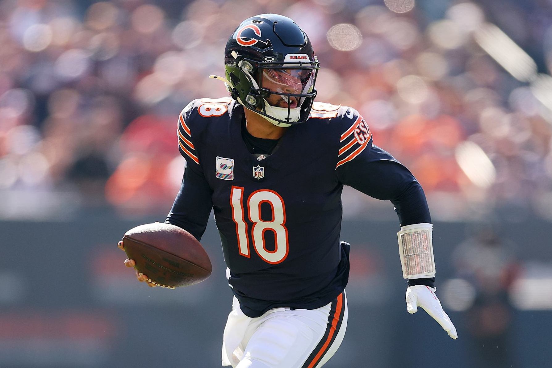 CHICAGO, ILLINOIS - OCTOBER 06: Caleb Williams #18 of the Chicago Bears runs with the ball against the Carolina Panthers during the second quarter at Soldier Field on October 06, 2024 in Chicago, Illinois. (Photo by Michael Reaves/Getty Images)