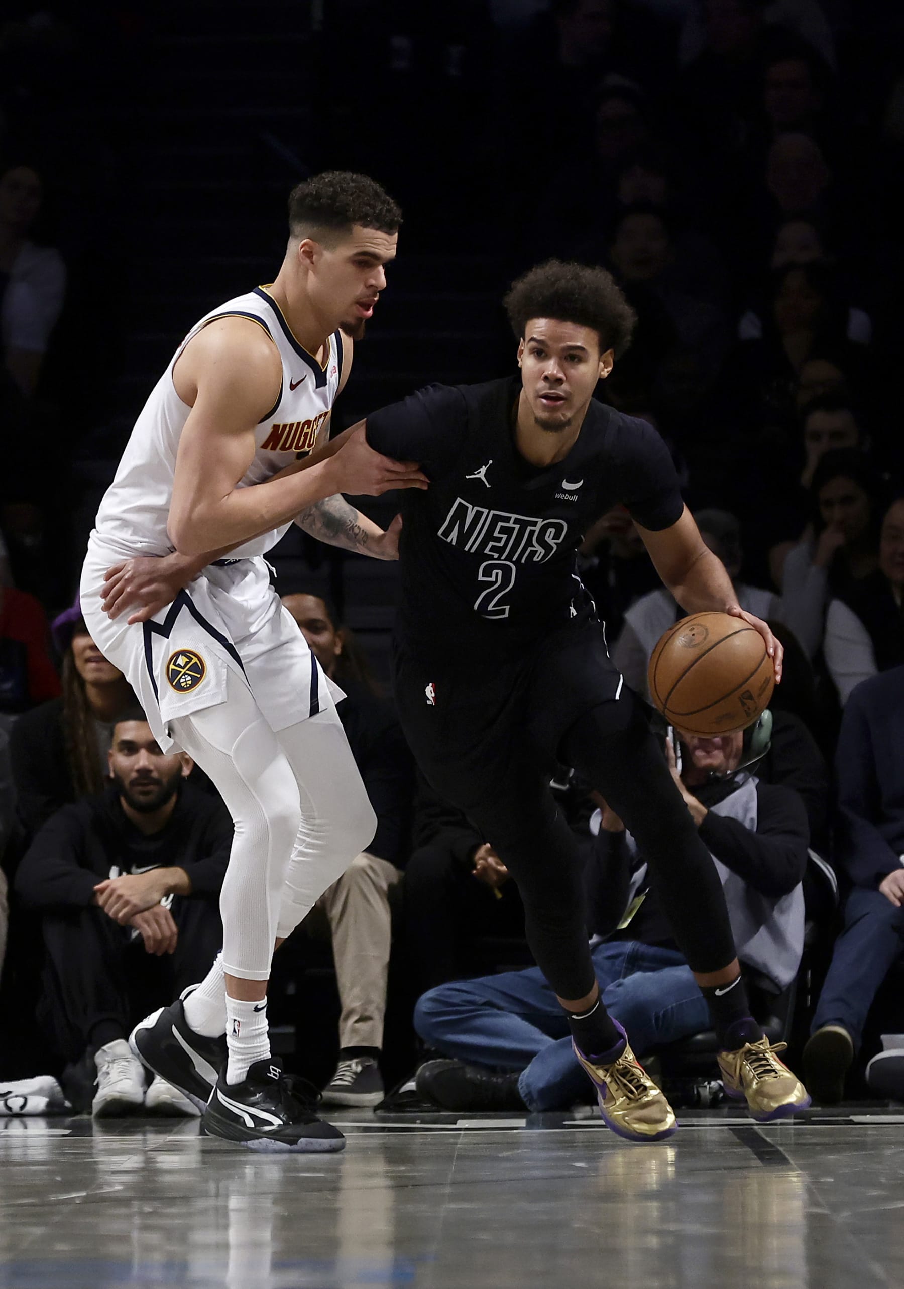 NEW YORK, NEW YORK - DECEMBER 22: (NEW YORK DAILIES OUT)  Cameron Johnson #2 of the Brooklyn Nets in action against Michael Porter Jr. #1 of the Denver Nuggets at Barclays Center on December 22, 2023 in New York City.  The Nuggets defeated the Nets 122-117. NOTE TO USER: User expressly acknowledges and agrees that, by downloading and or using this photograph, User is consenting to the terms and conditions of the Getty Images License Agreement. (Photo by Jim McIsaac/Getty Images)