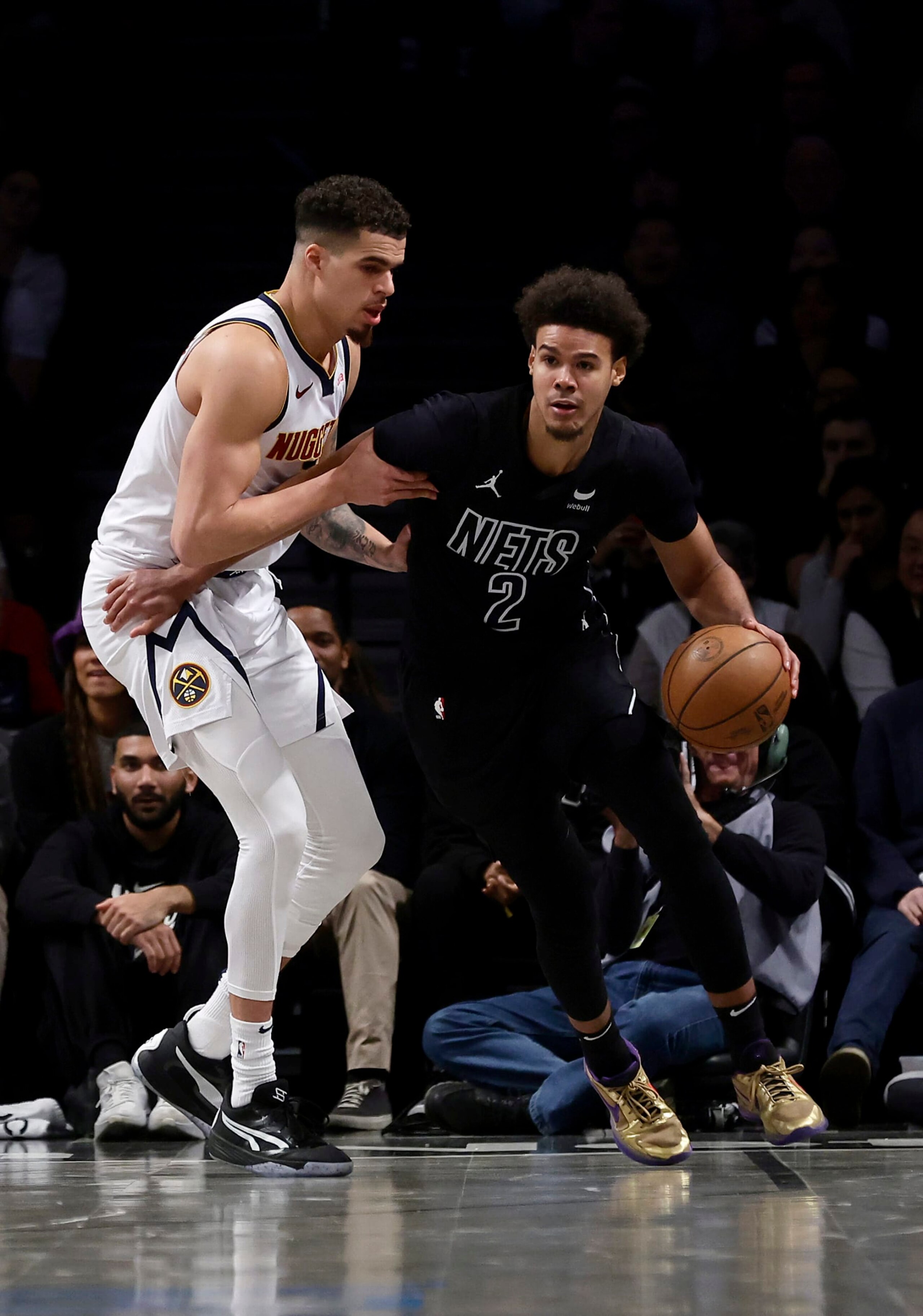 NEW YORK, NEW YORK - DECEMBER 22: (NEW YORK DAILIES OUT)  Cameron Johnson #2 of the Brooklyn Nets in action against Michael Porter Jr. #1 of the Denver Nuggets at Barclays Center on December 22, 2023 in New York City.  The Nuggets defeated the Nets 122-117. NOTE TO USER: User expressly acknowledges and agrees that, by downloading and or using this photograph, User is consenting to the terms and conditions of the Getty Images License Agreement. (Photo by Jim McIsaac/Getty Images)