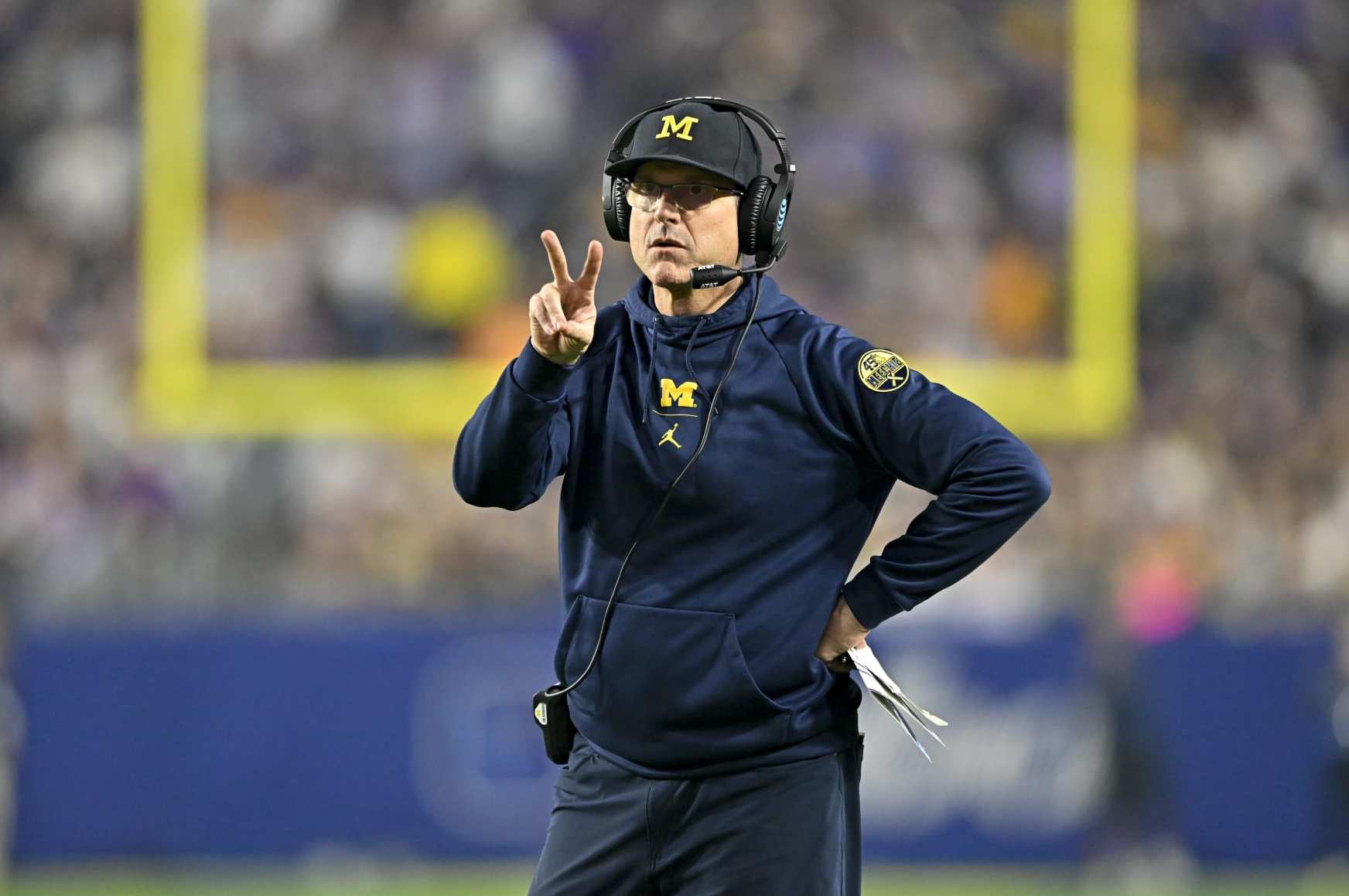 GLENDALE, ARIZONA - DECEMBER 31: Head coach Jim Harbaugh of the Michigan Wolverines calls for a two point conversion during the third quarter of the College Football Playoff Semifinal Fiesta Bowl football game against the TCU Horned Frogs at State Farm Stadium on December 31, 2022 in Glendale, Arizona. The TCU Horned Frogs won 51-45. (Photo by Alika Jenner/Getty Images)