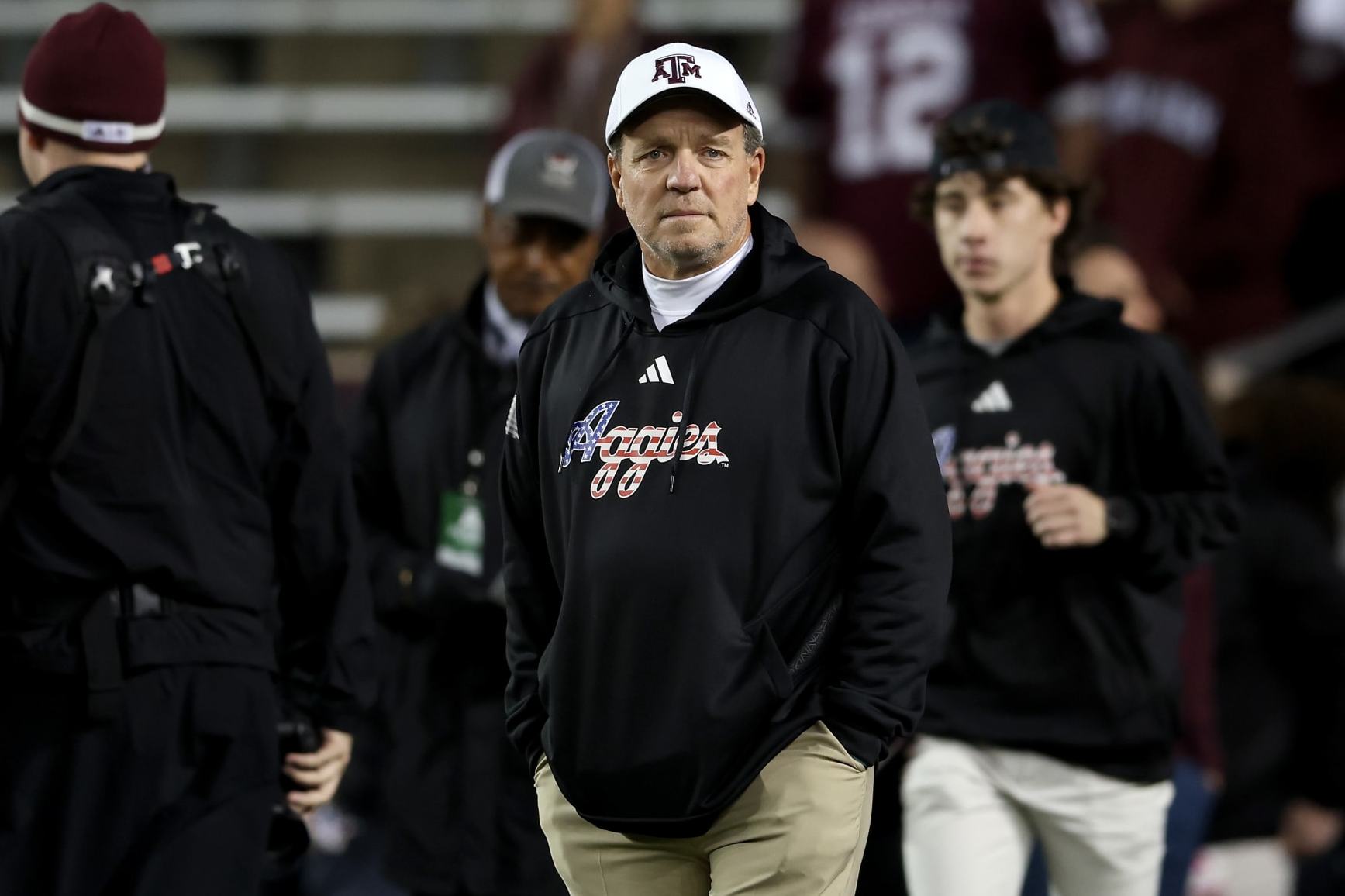 COLLEGE STATION, TEXAS - NOVEMBER 11: Head coach Jimbo Fisher of the Texas A&M Aggies watches players warm up before the game against the Mississippi State Bulldogs at Kyle Field on November 11, 2023 in College Station, Texas. (Photo by Tim Warner/Getty Images)