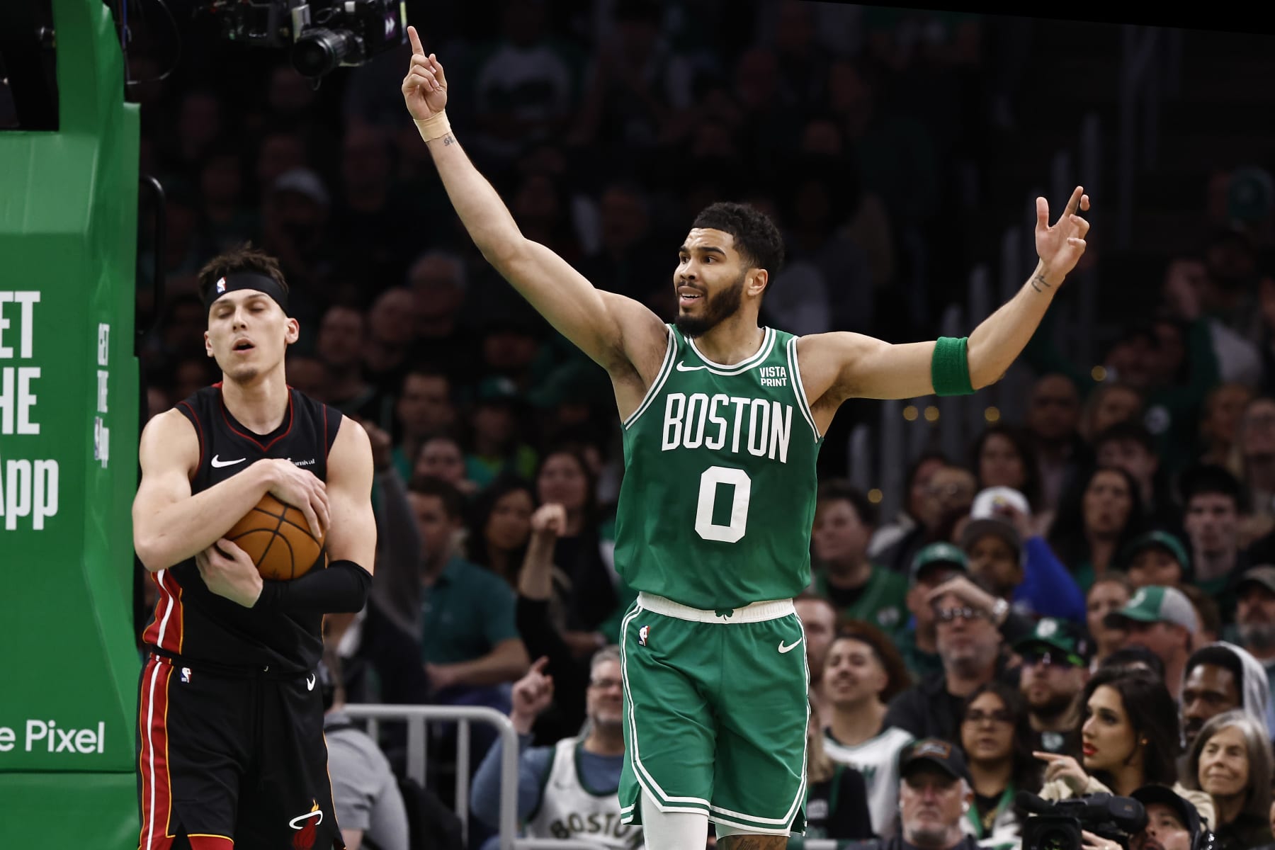 BOSTON, MA - APRIL 24: Jayson Tatum #0 of the Boston Celtics pleads for a goaltending call as Tyler Herro #14 of the Miami Heat cradles the ball during the second quarter of game two of the Eastern Conference First Round Playoffs at TD Garden on April 24, 2024 in Boston, Massachusetts. NOTE TO USER: User expressly acknowledges and agrees that, by downloading and/or using this Photograph, user is consenting to the terms and conditions of the Getty Images License Agreement. (Photo By Winslow Townson/Getty Images)