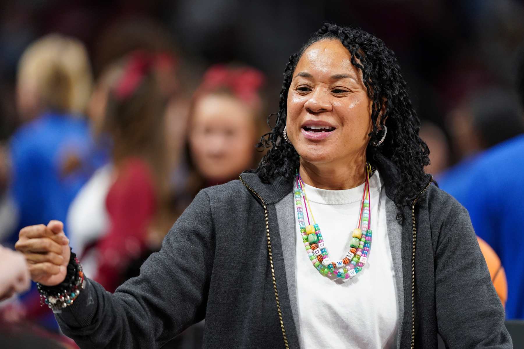 COLUMBIA, SOUTH CAROLINA - DECEMBER 5: Head coach Dawn Staley of the South Carolina Gamecocks fist bumps people at the scorer's table beforef an NCAA women's basketball game against the Duke Blue Devils at Colonial Life Arena on December 5, 2024 in Columbia, South Carolina. The South Carolina Gamecocks won 81-70. (Photo by Sean Rayford/Getty Images)