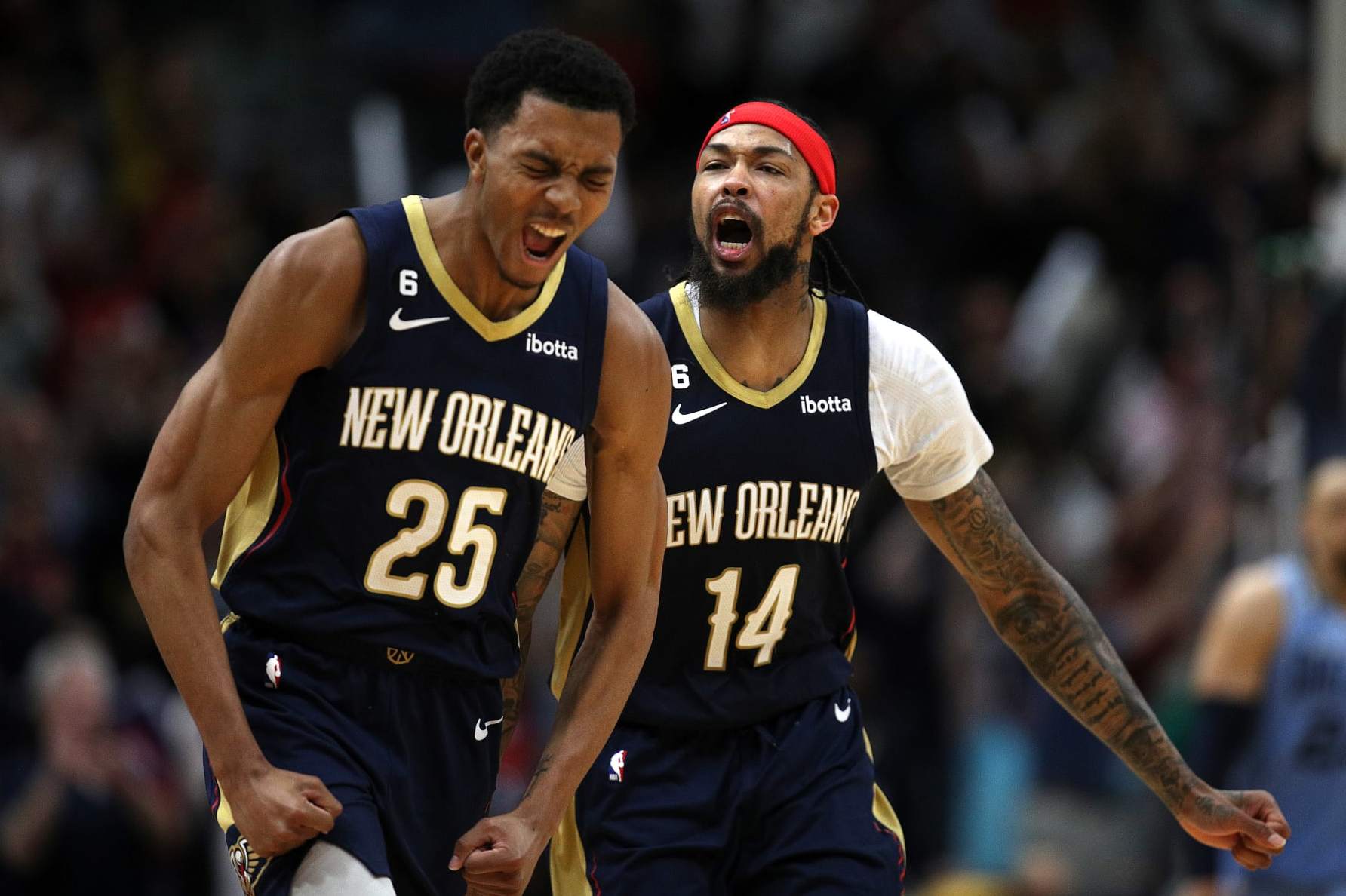 NEW ORLEANS, LOUISIANA - APRIL 05: Brandon Ingram #14 of the New Orleans Pelicans reacts with Trey Murphy III #25 of the New Orleans Pelicans after scoring a three point basket during the fourth quarter of an NBA game against the Memphis Grizzlies at Smoothie King Center on April 05, 2023 in New Orleans, Louisiana. NOTE TO USER: User expressly acknowledges and agrees that, by downloading and or using this photograph, User is consenting to the terms and conditions of the Getty Images License Agreement. (Photo by Sean Gardner/Getty Images)