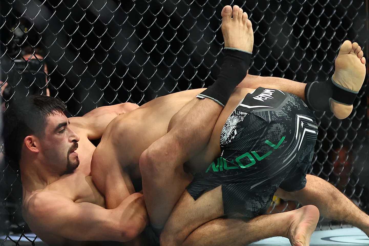 PERTH, AUSTRALIA - AUGUST 18: Jesus Aguilar of Mexico secures a guillotine choke submission against Stewart Nicoll of Australia compete in their Flyweight Bout during UFC 305 at RAC Arena on August 18, 2024 in Perth, Australia. (Photo by Paul Kane/Getty Images)