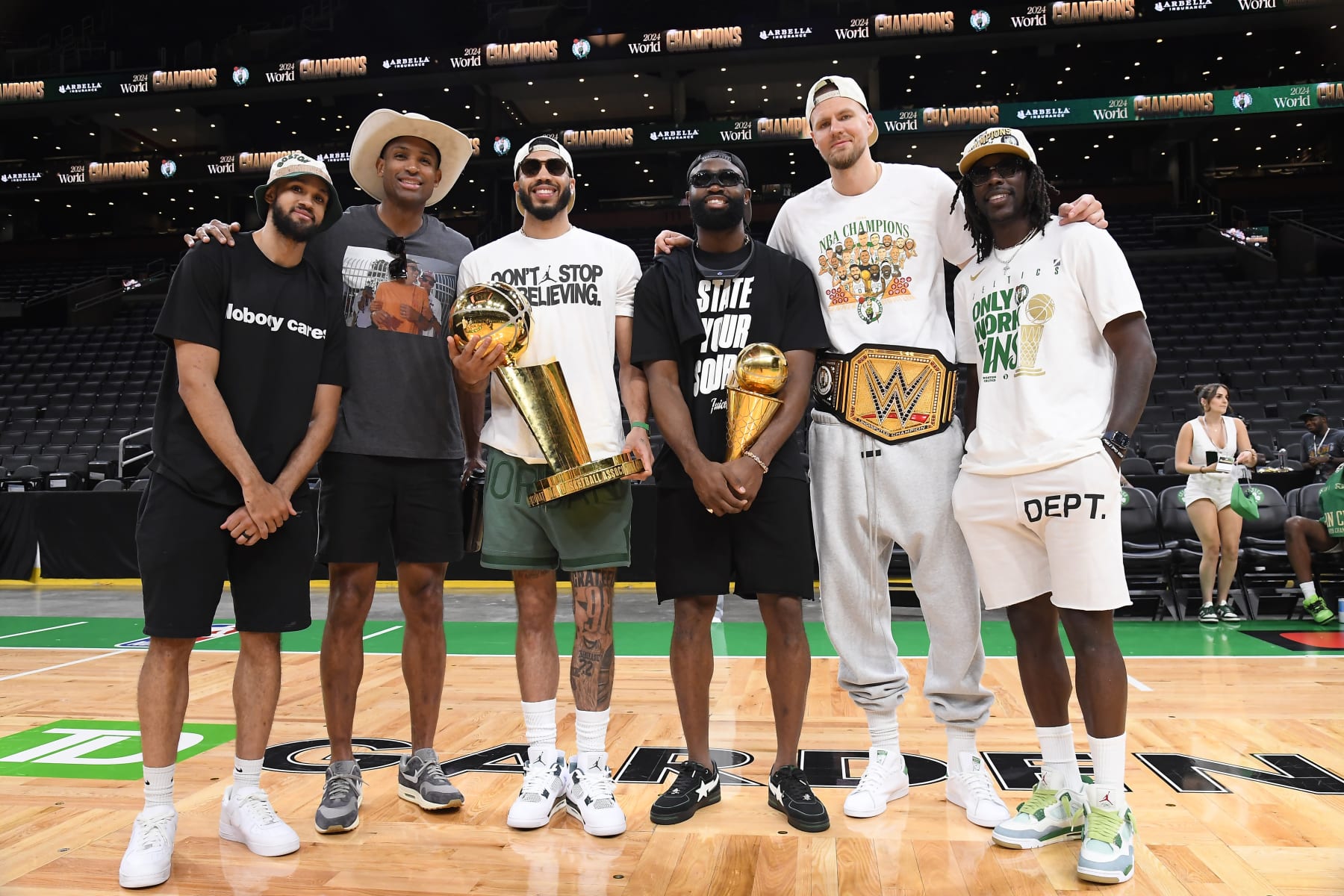 BOSTON, MA - JUNE 21: Derrick White #9, Al Horford #42, Jayson Tatum #0, Jaylen Brown #7, Kristaps Porzingis #8, and Jrue Holiday #4 of the Boston Celtics pose for a photo with the Larry O'Brien Trophy and the Bill Russell Finals MVP Trophy before the 2024 Boston Celtics championship parade on June 21, 2024 in Boston, Massachusetts. NOTE TO USER: User expressly acknowledges and agrees that, by downloading and or using this photograph, User is consenting to the terms and conditions of the Getty Images License Agreement. Mandatory Copyright Notice: Copyright 2024 NBAE (Photo by Brian Babineau/NBAE via Getty Images)