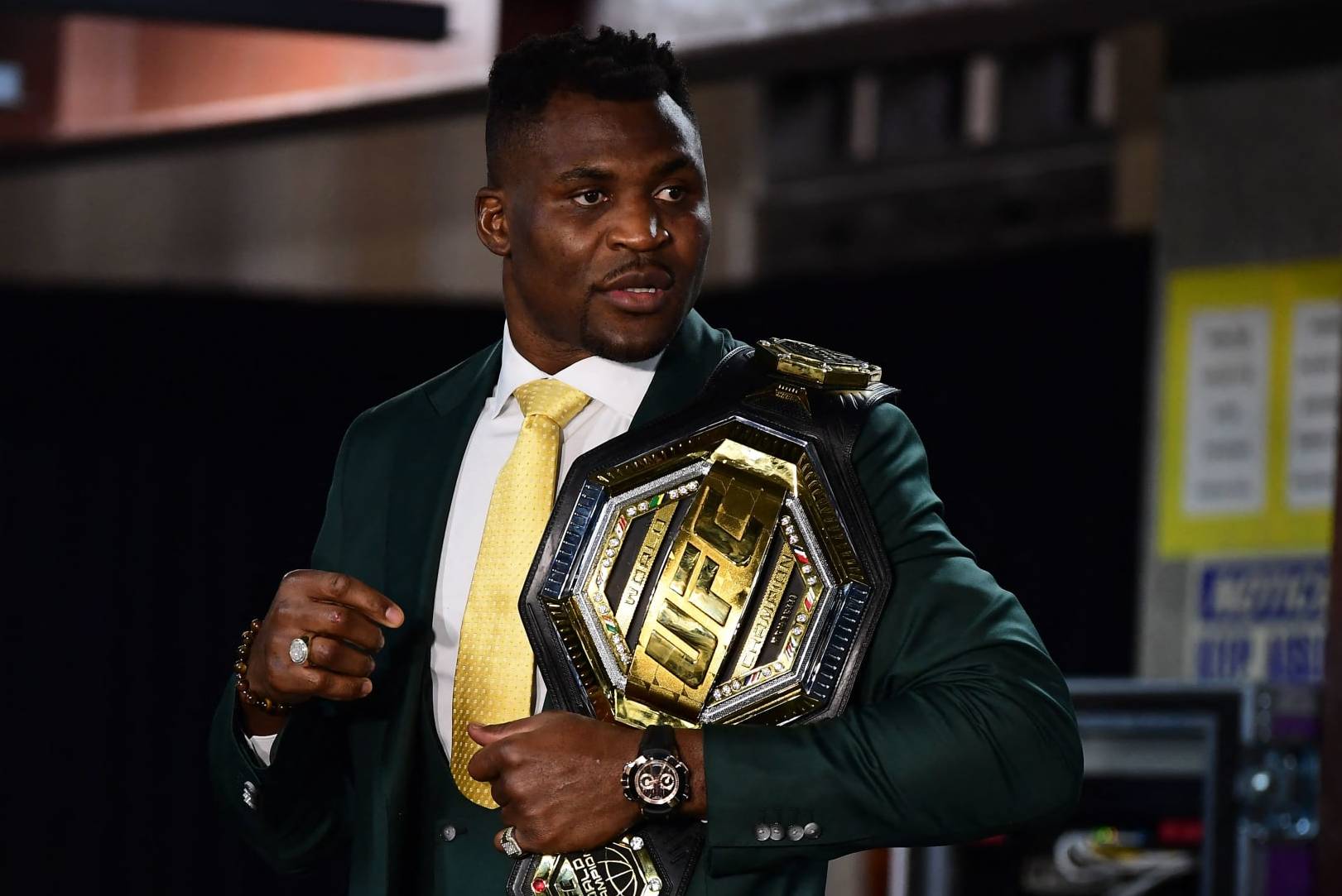 Champion Cameroon's Francis Ngannou holds the championship belt in the press room after defeating French Ciryl Gane in their UFC 270 championship fight in Anaheim on January 22, 2022. (Photo by Frederic J. BROWN / AFP) (Photo by FREDERIC J. BROWN/AFP via Getty Images)