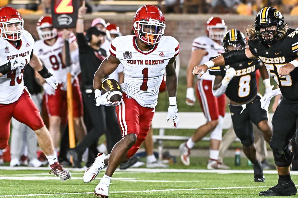 COLUMBIA, MO - AUGUST 31: After intercepting the ball, South Dakota Coyotes defensive back Myles Harden (1) runs with it for more yardage during a non conference game between the South Dakota Coyotes and the Missouri Tigers held on Thursday Aug 31, 2023 at Faurot Field at Memorial Stadium in Columbia MO. (Photo by Rick Ulreich/Icon Sportswire via Getty Images