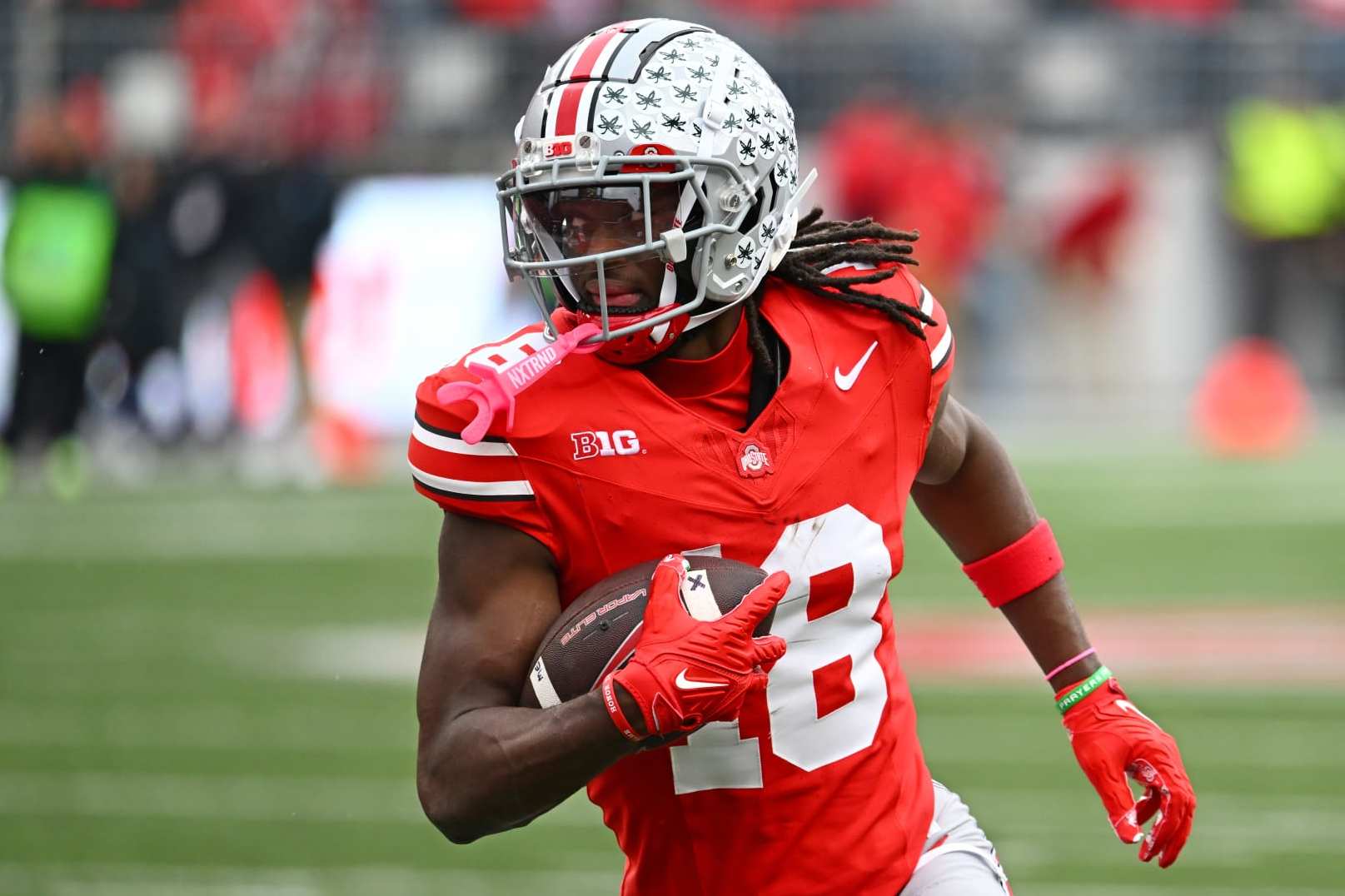 COLUMBUS, OHIO - OCTOBER 21: Marvin Harrison Jr. #18 of the Ohio State Buckeyes runs with the ball during the fourth quarter of a game against the Penn State Nittany Lions at Ohio Stadium on October 21, 2023 in Columbus, Ohio. (Photo by Ben Jackson/Getty Images)