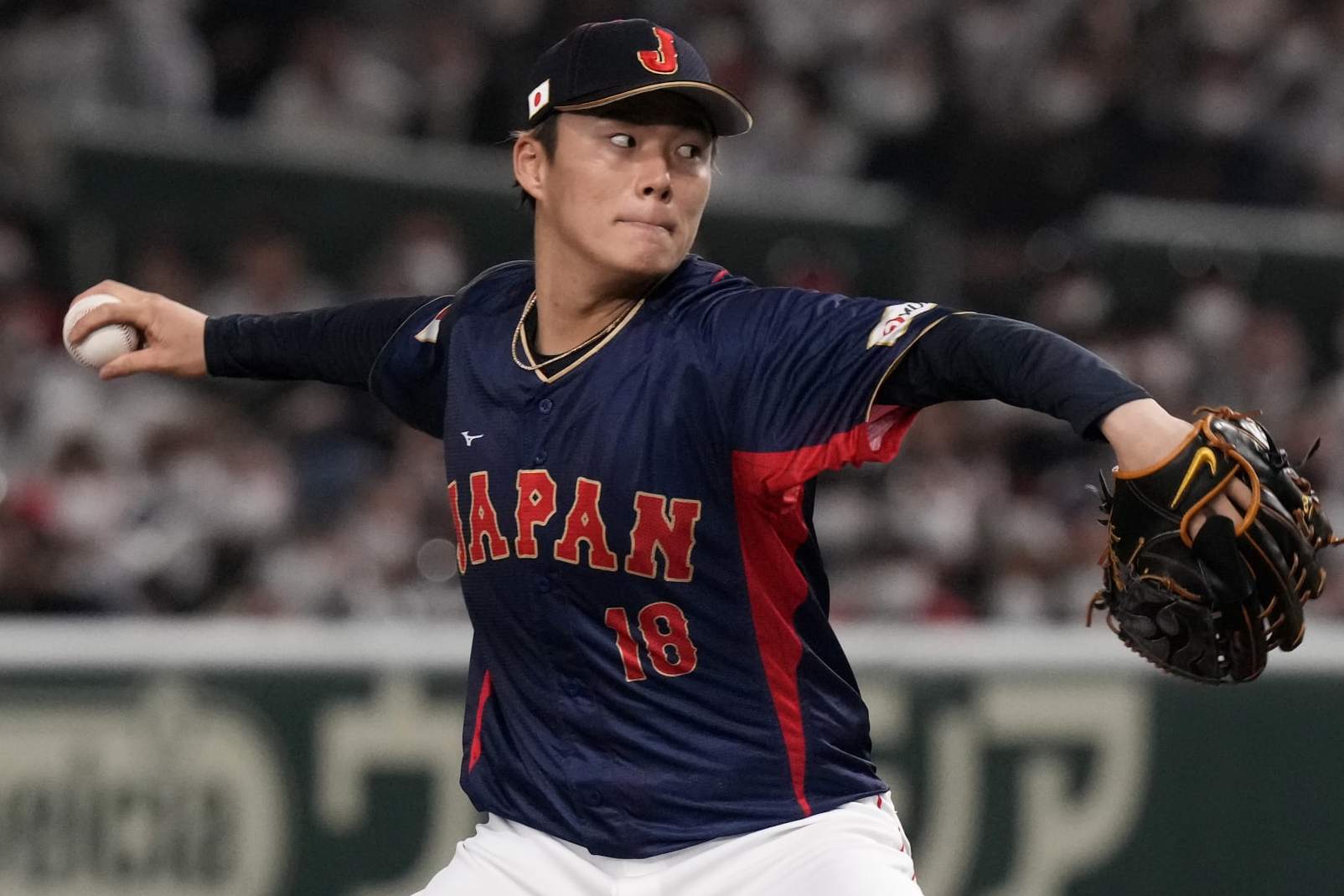Yoshinobu Yamamoto of Japan pitches to Australia win the 1rst inning during their Pool B game at the World Baseball Classic at the Tokyo Dome Sunday, March 12, 2023, in Tokyo. (AP Photo/Eugene Hoshiko)