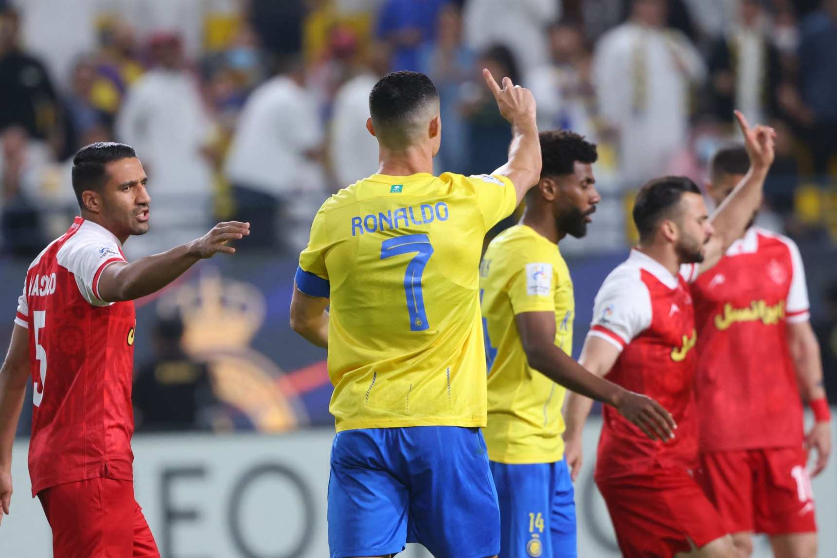 Nassr's Portuguese forward #07 Cristiano Ronaldo tells the referee that there was no foul and no need for a penalty during the AFC Champions League Group E football match between Saudi's al-Nassr and Iran's Persepolis at the Al-Awwal Stadium in Riyadh on November 27, 2023. (Photo by Fayez NURELDINE / AFP) (Photo by FAYEZ NURELDINE/AFP via Getty Images)