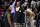 Brooklyn Nets' Kevin Durant, center, smiles with teammates Kyrie Irving, left, and James Harden during the second half of an NBA basketball game Wednesday, Jan. 12, 2022, in Chicago. (AP Photo/Charles Rex Arbogast)