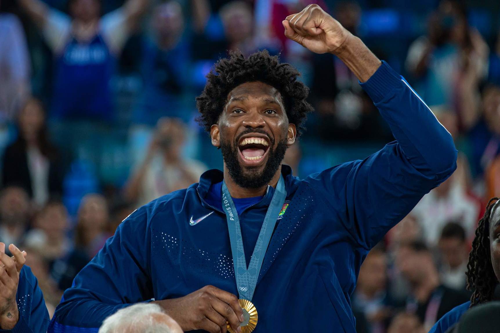 PARIS, FRANCE - AUGUST 10: Joel Embiid #11 of United States celebrates with his gold medal during the Men's Basketball Medal Ceremony on day fifteen of the Olympic Games Paris 2024 at Stade Bercy Arena on August 10, 2024 in Paris, France. (Photo by RvS.Media/Monika Majer/Getty Images)