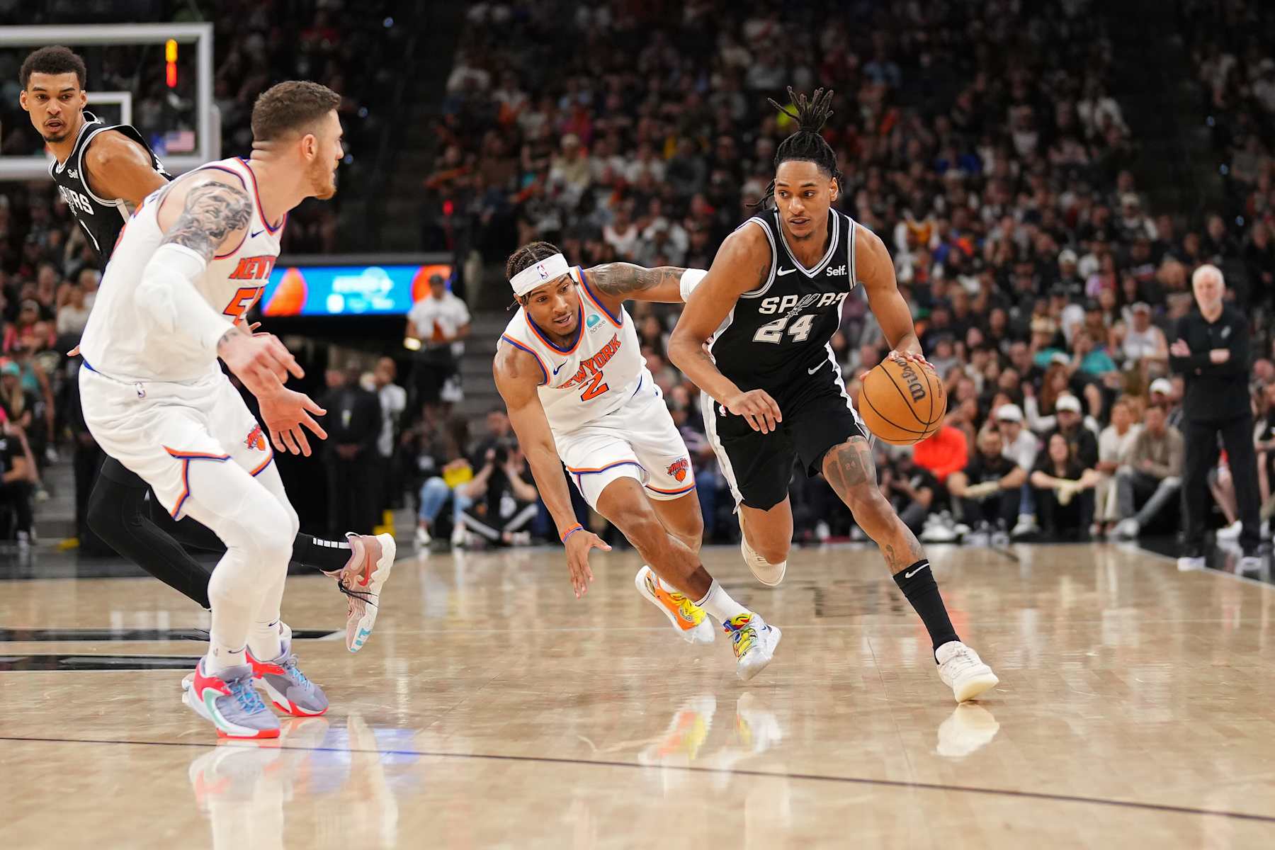 SAN ANTONIO, TX - MARCH 29: Miles McBride #2 of the New York Knicks plays defense against Devin Vassell #24 of the San Antonio Spurs on March 29, 2024 at the Frost Bank Center in San Antonio, Texas. NOTE TO USER: User expressly acknowledges and agrees that, by downloading and or using this photograph, user is consenting to the terms and conditions of the Getty Images License Agreement. Mandatory Copyright Notice: Copyright 2024 NBAE (Photos by Darren Carroll/NBAE via Getty Images)