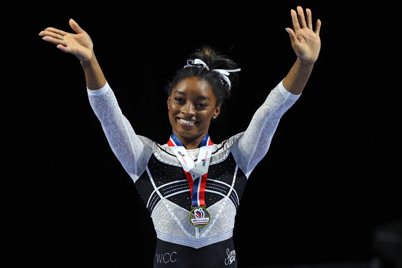 HOFFMAN ESTATES, ILLINOIS - AUGUST 05: Simone Biles celebrates after winning the all-around at the Core Hydration Classic at Now Arena on August 05, 2023 in Hoffman Estates, Illinois. (Photo by Stacy Revere/Getty Images)