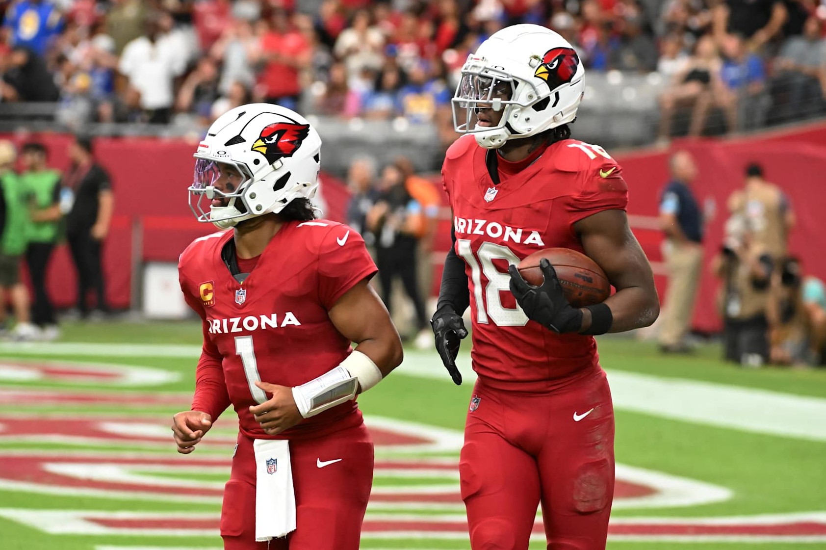 GLENDALE, ARIZONA - SEPTEMBER 15: Marvin Harrison Jr #18 of the Arizona Cardinals runs off the field with Kyler Murray #1 after scoring a touch down against the Los Angeles Rams at State Farm Stadium on September 15, 2024 in Glendale, Arizona. (Photo by Norm Hall/Getty Images)
