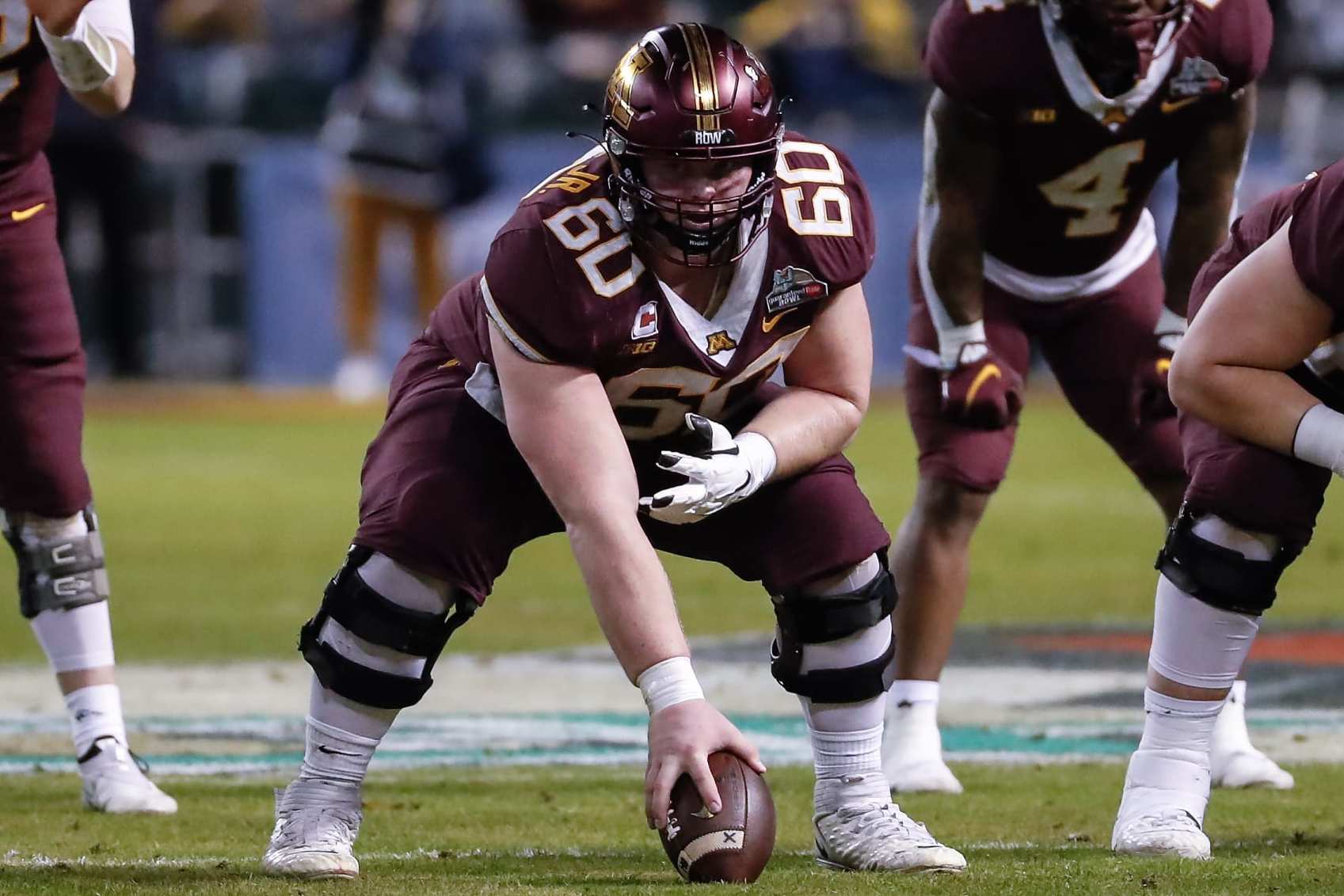 PHOENIX, AZ - DECEMBER 28:  Minnesota Golden Gophers offensive lineman John Michael Schmitz (60) lines up during the Guaranteed Rate Bowl college football game between the West Virginia Mountaineers and the Minnesota Golden Gophers on December 28, 2021 at Chase Field in Phoenix, Arizona. (Photo by Kevin Abele/Icon Sportswire via Getty Images)