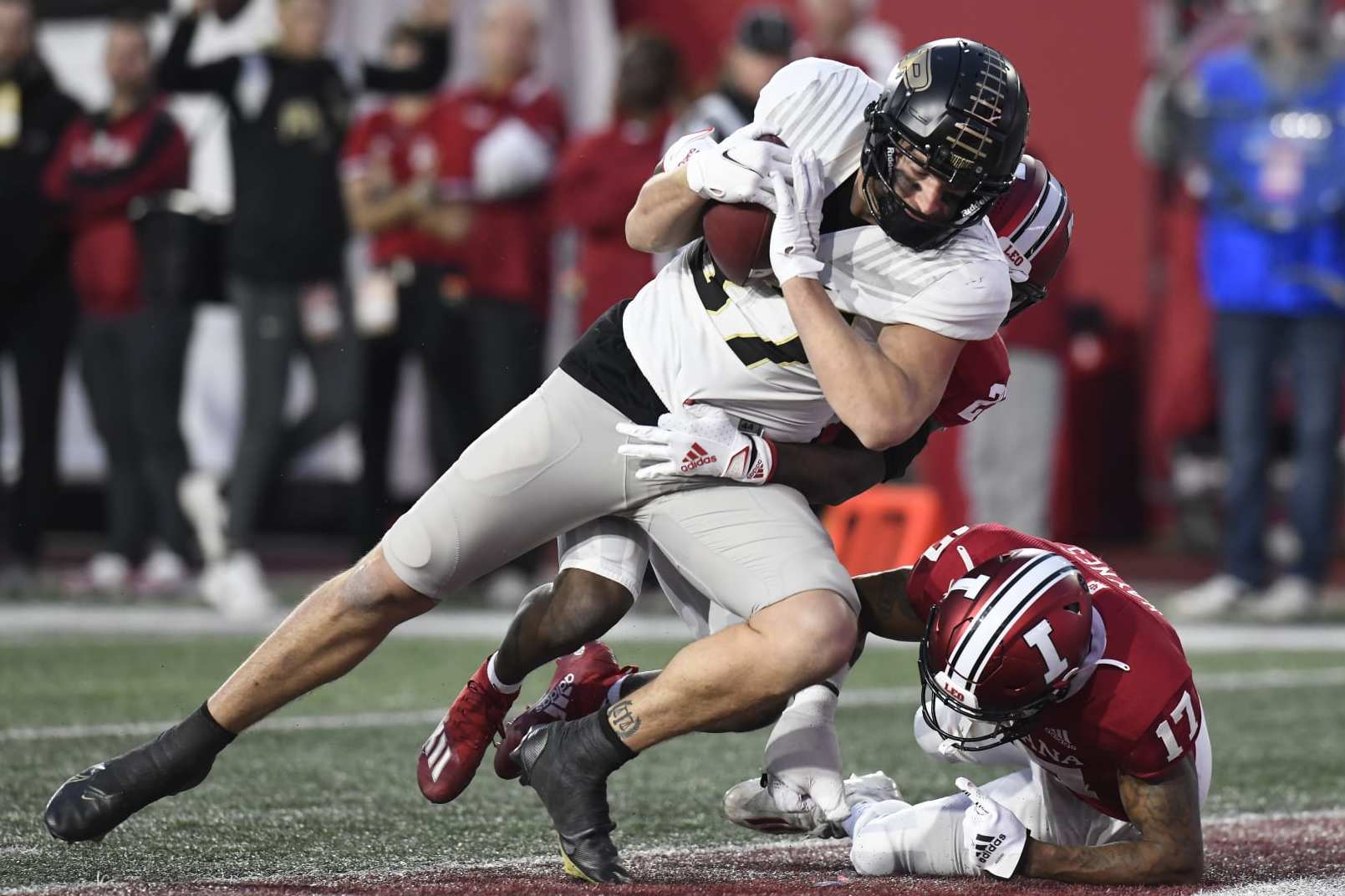 BLOOMINGTON, IN - NOVEMBER 26: Purdue Boilermakers tight end Payne Durham (87) scores a touchdown as Indiana Hoosiers defensive back Jaylin Williams (23) and Indiana Hoosiers defensive back Jonathan Haynes (17) defend during the college football game between the Purdue Boilermakers and the Indiana Hoosiers on November 26, 2022, at Memorial Stadium in Bloomington, Indiana. (Photo by Michael Allio/Icon Sportswire via Getty Images)