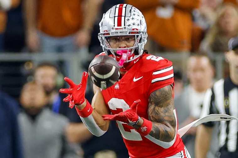 ARLINGTON, TEXAS - JANUARY 10: Emeka Egbuka #2 of the Ohio State Buckeyes catches a pass during the first quarter against the Texas Longhorns during the Goodyear Cotton Bowl at AT&T Stadium on January 10, 2025 in Arlington, Texas. (Photo by CFP/Getty Images)