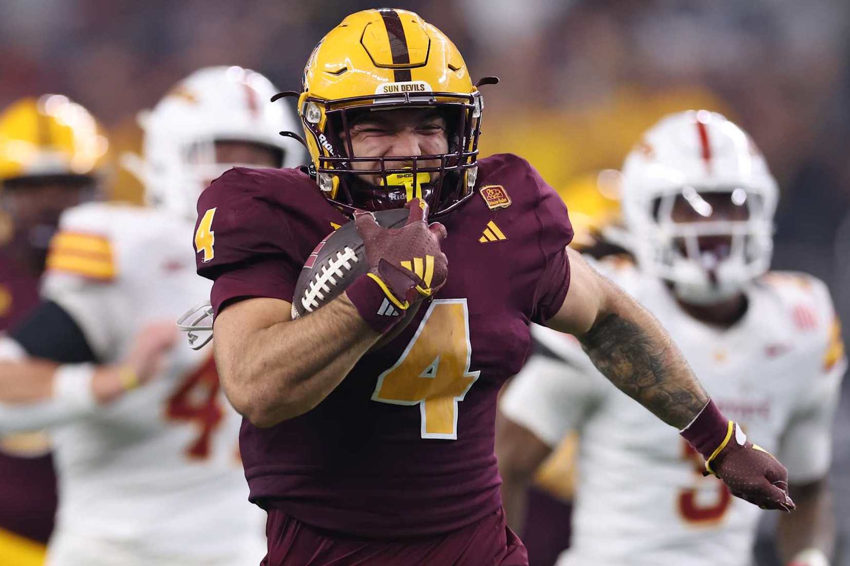 ARLINGTON, TEXAS - DECEMBER 07: Cam Skattebo #4 of the Arizona State Sun Devils carries the ball against the Iowa State Cyclones during the second quarter of the Big 12 Championship game at AT&T Stadium on December 07, 2024 in Arlington, Texas. (Photo by Sam Hodde/Getty Images)