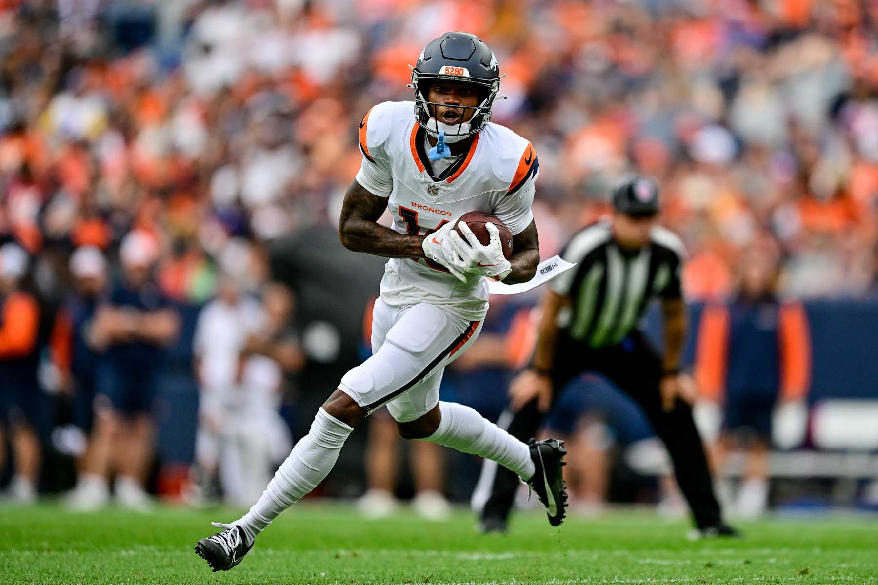 DENVER, COLORADO - AUGUST 25:  Troy Franklin #16 of the Denver Broncos carries the ball against the Arizona Cardinals in the first quarter during the preseason game at Empower Field at Mile High on August 25, 2024 in Denver, Colorado. (Photo by Dustin Bradford/Getty Images)