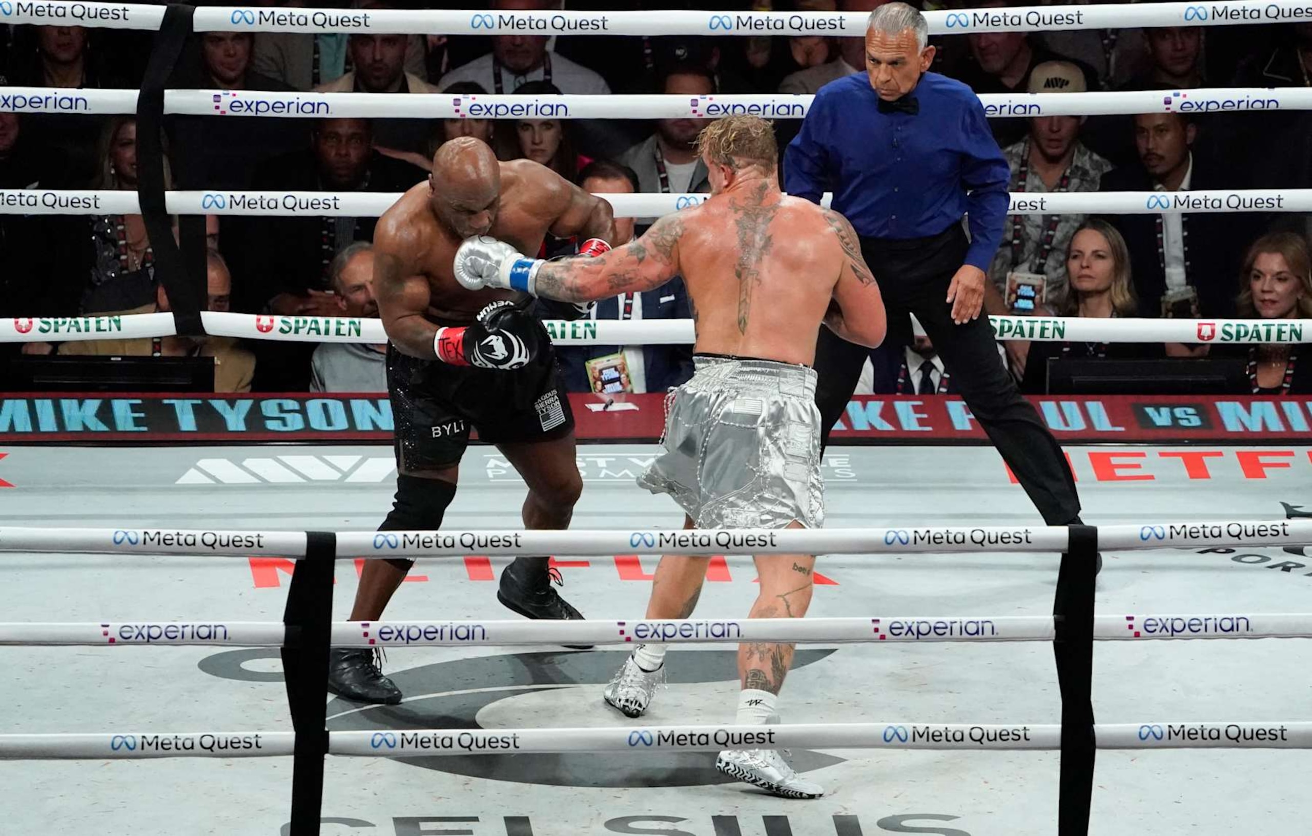 Referee Mark Calo-oy watches US retired pro-boxer Mike Tyson (L) and US YouTuber/boxer Jake Paul (R) fight during the heavyweight boxing bout at The Pavilion at AT&T Stadium in Arlington, Texas, November 15, 2024. (Photo by TIMOTHY A. CLARY / AFP) (Photo by TIMOTHY A. CLARY/AFP via Getty Images)